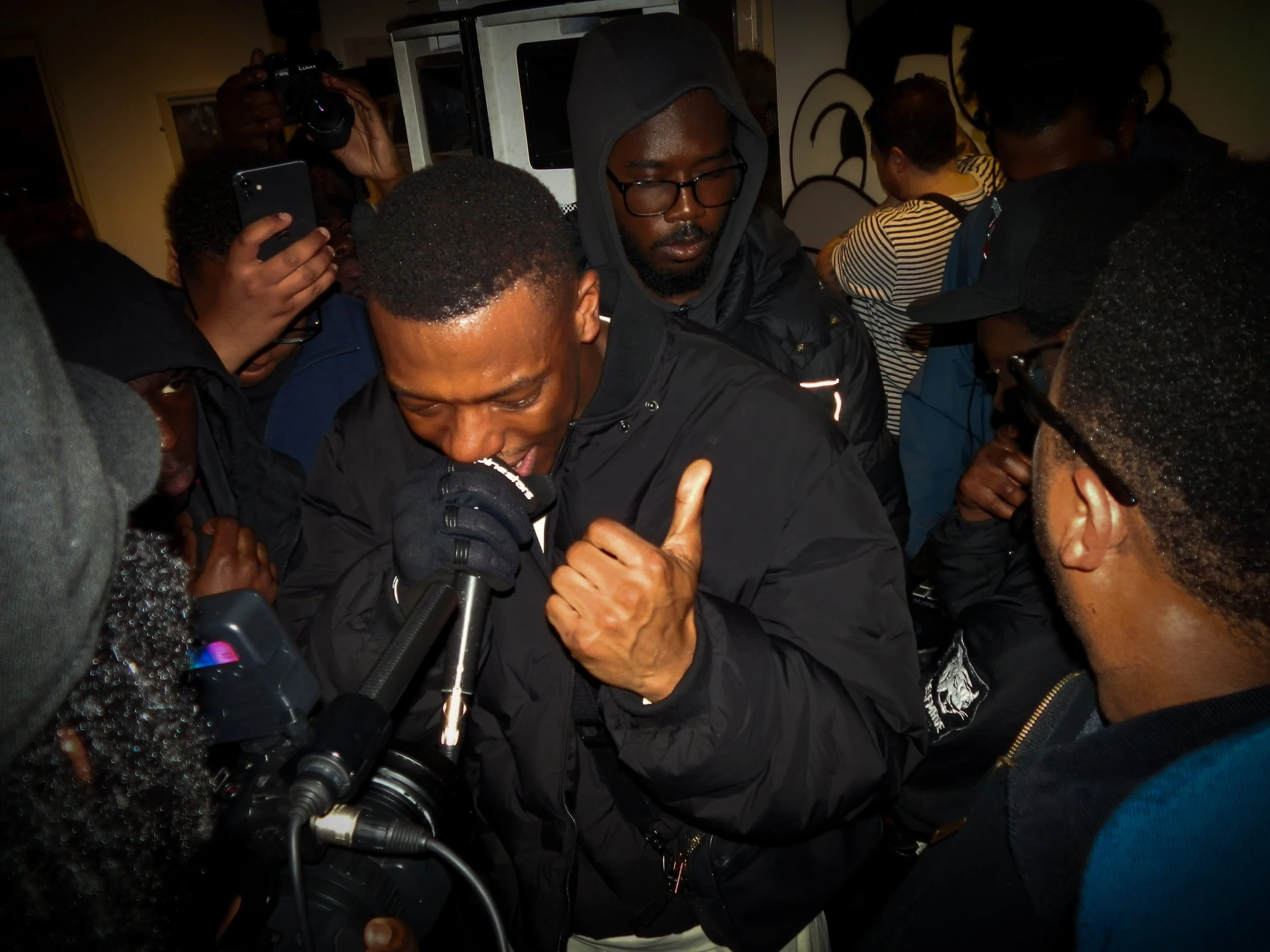 grime musician duppy mcing at victory lap collaboration pop up cypher with simon Wheatley for his book don't call me urban