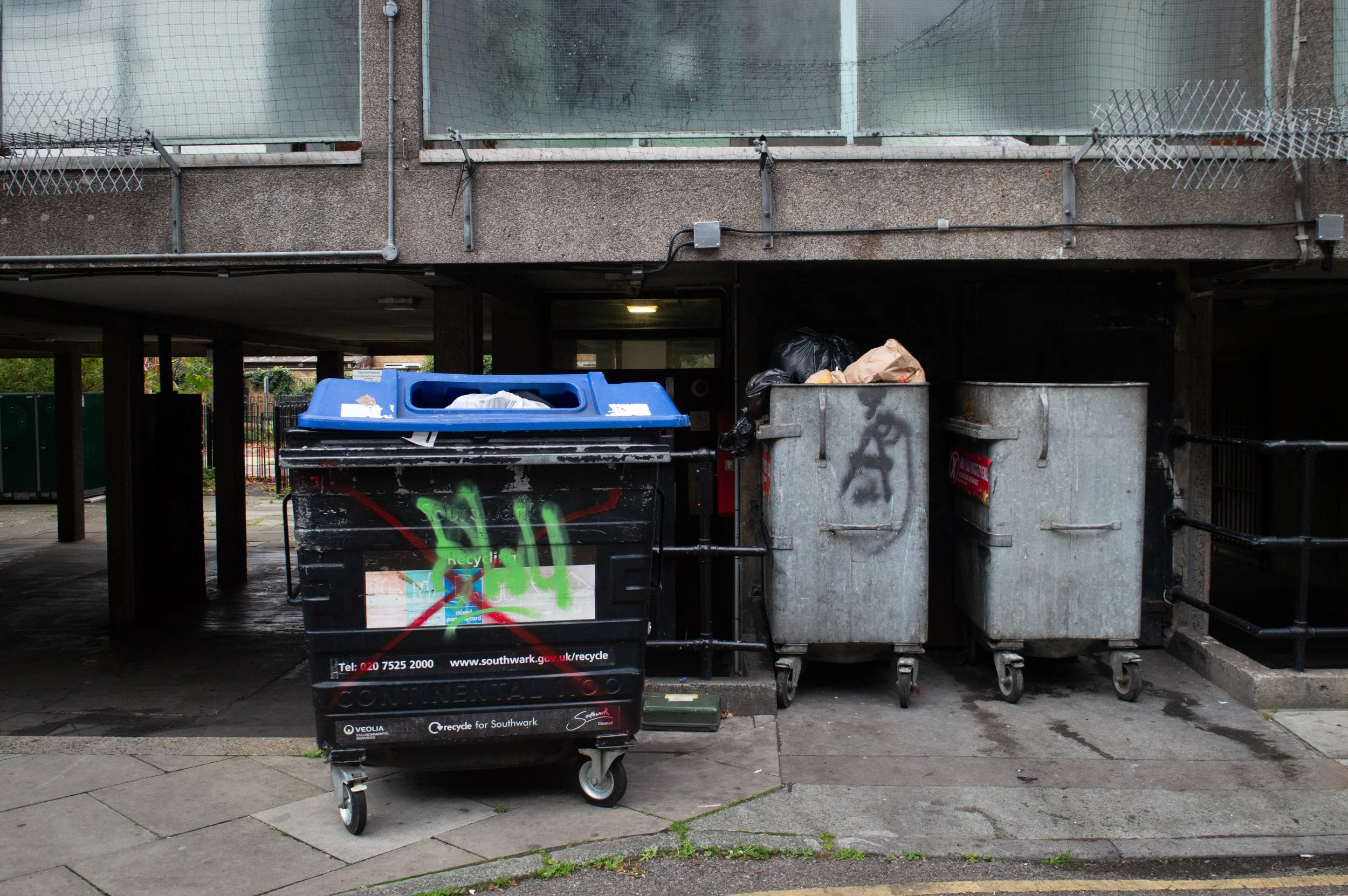 council estate bins with vandalism on them