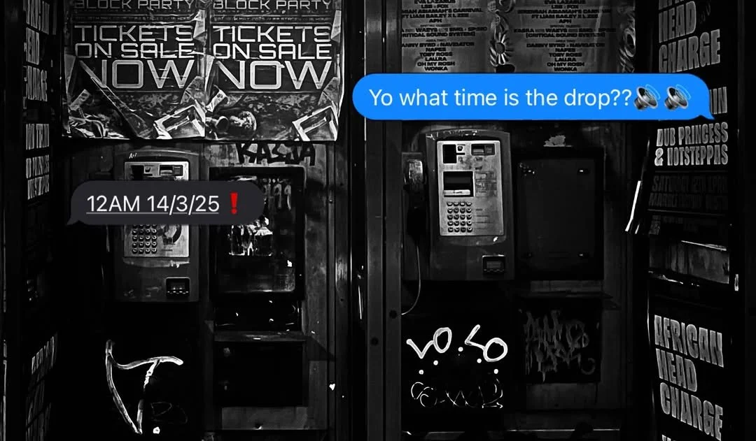 a black and white photo of a phone box with posters in and text style captions layered over the top saying, 'yo what time is the drop??🔊🔊' and a reply saying '12AM 12/3/25❗️'