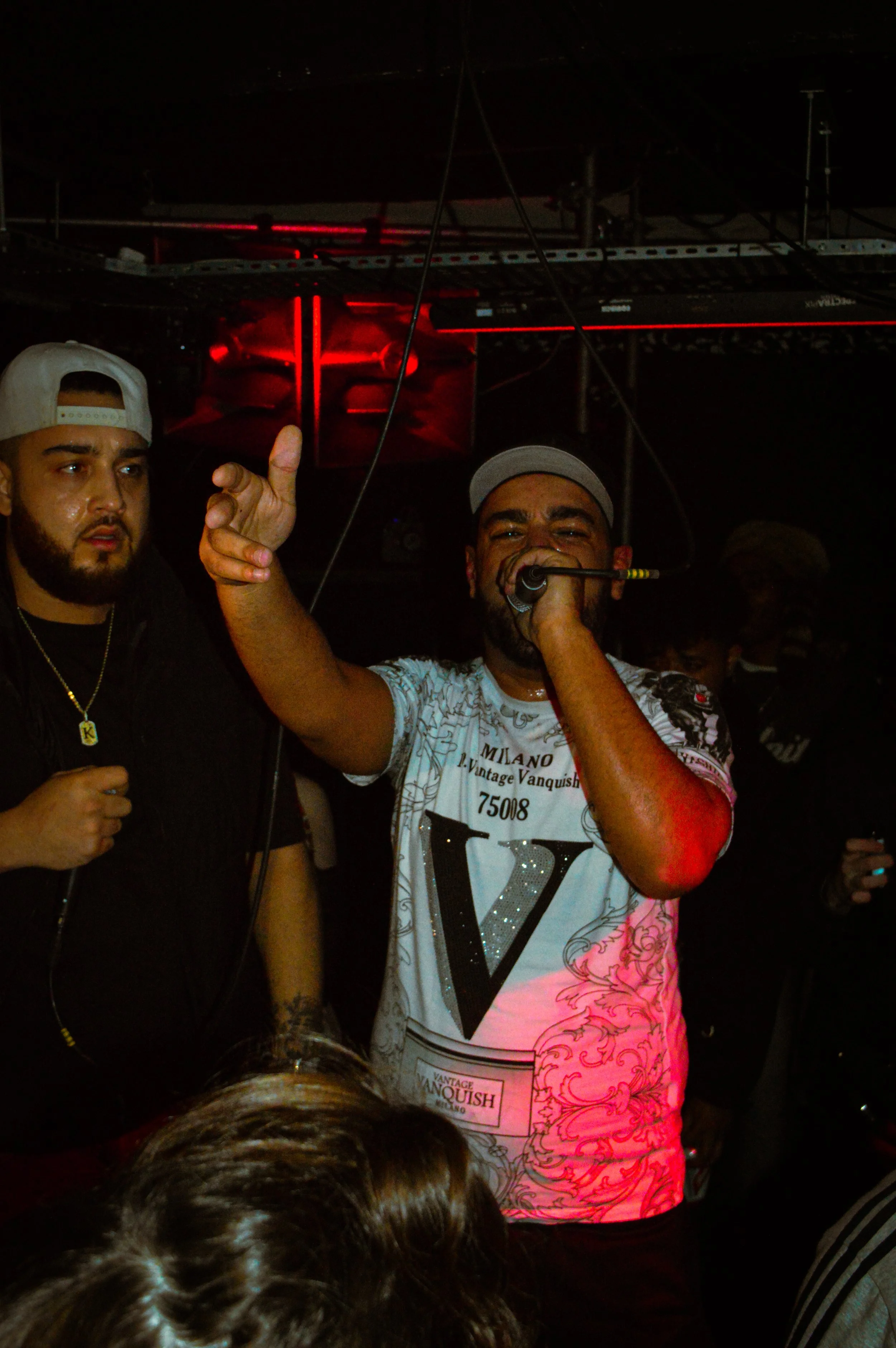 mc performing in the middle of wheel up grime rave 