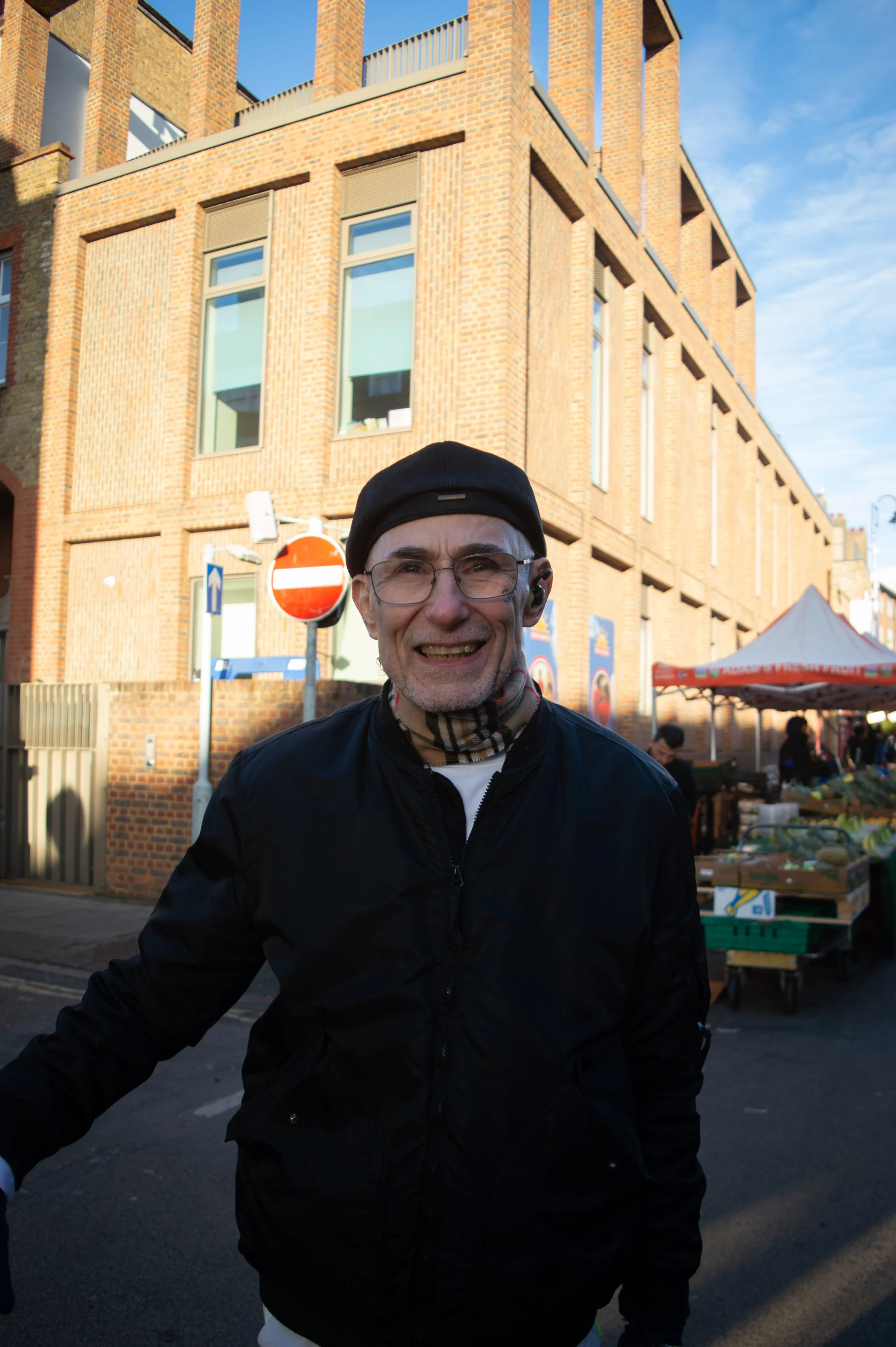 Portrait of an elderly man with face tattoos at East Street Market