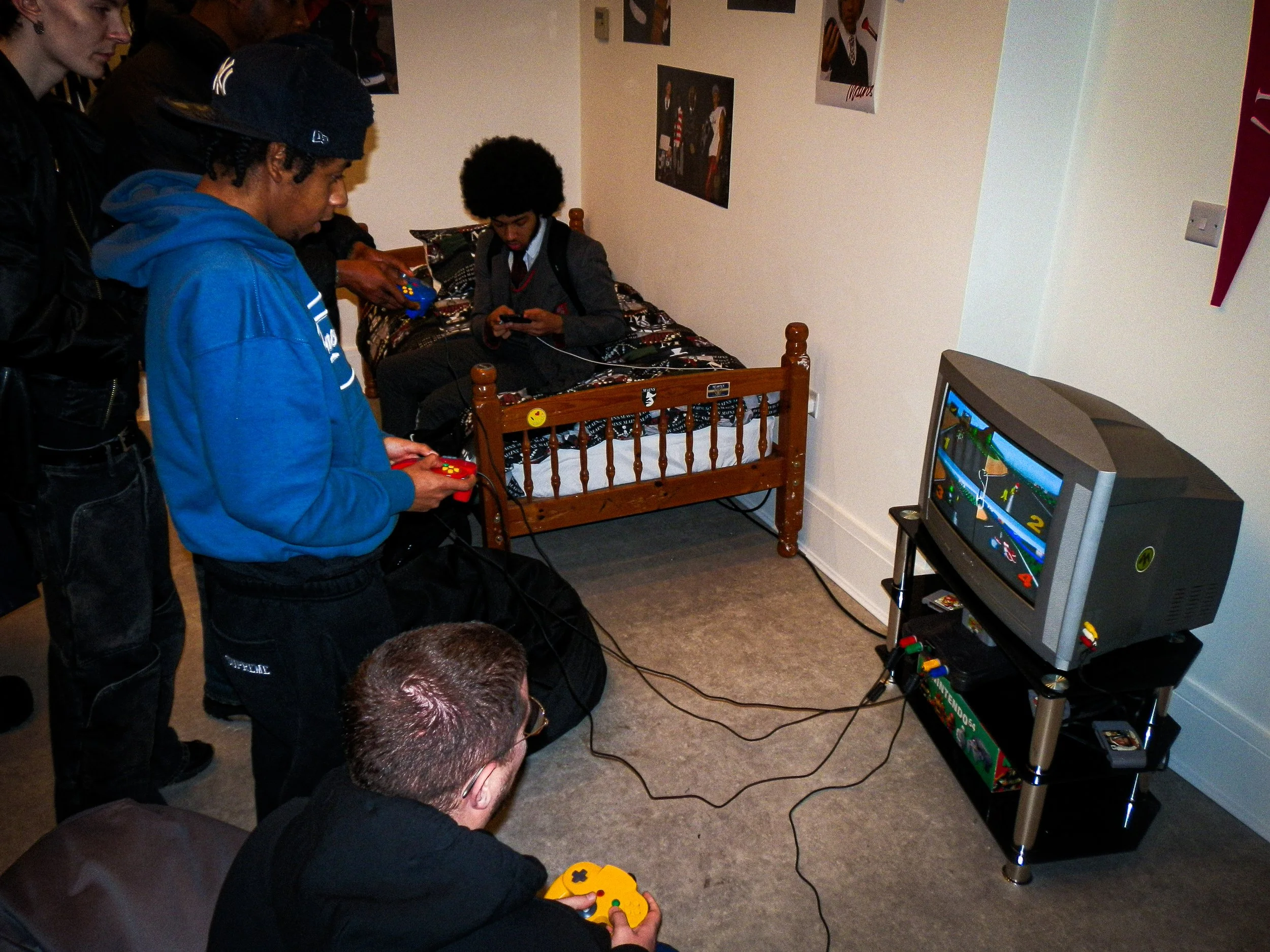 people playing retro video games at the mains pop up shop