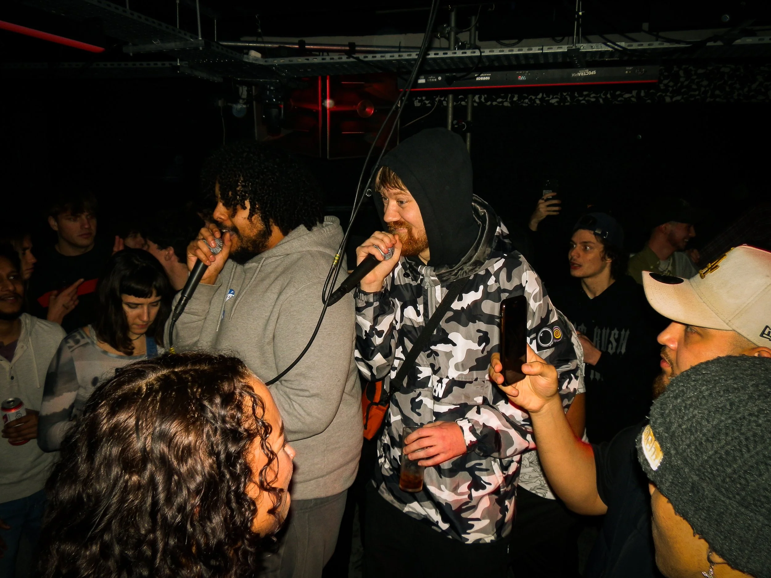 mc's performing in the middle of a crowd at Wheel Up grime rave