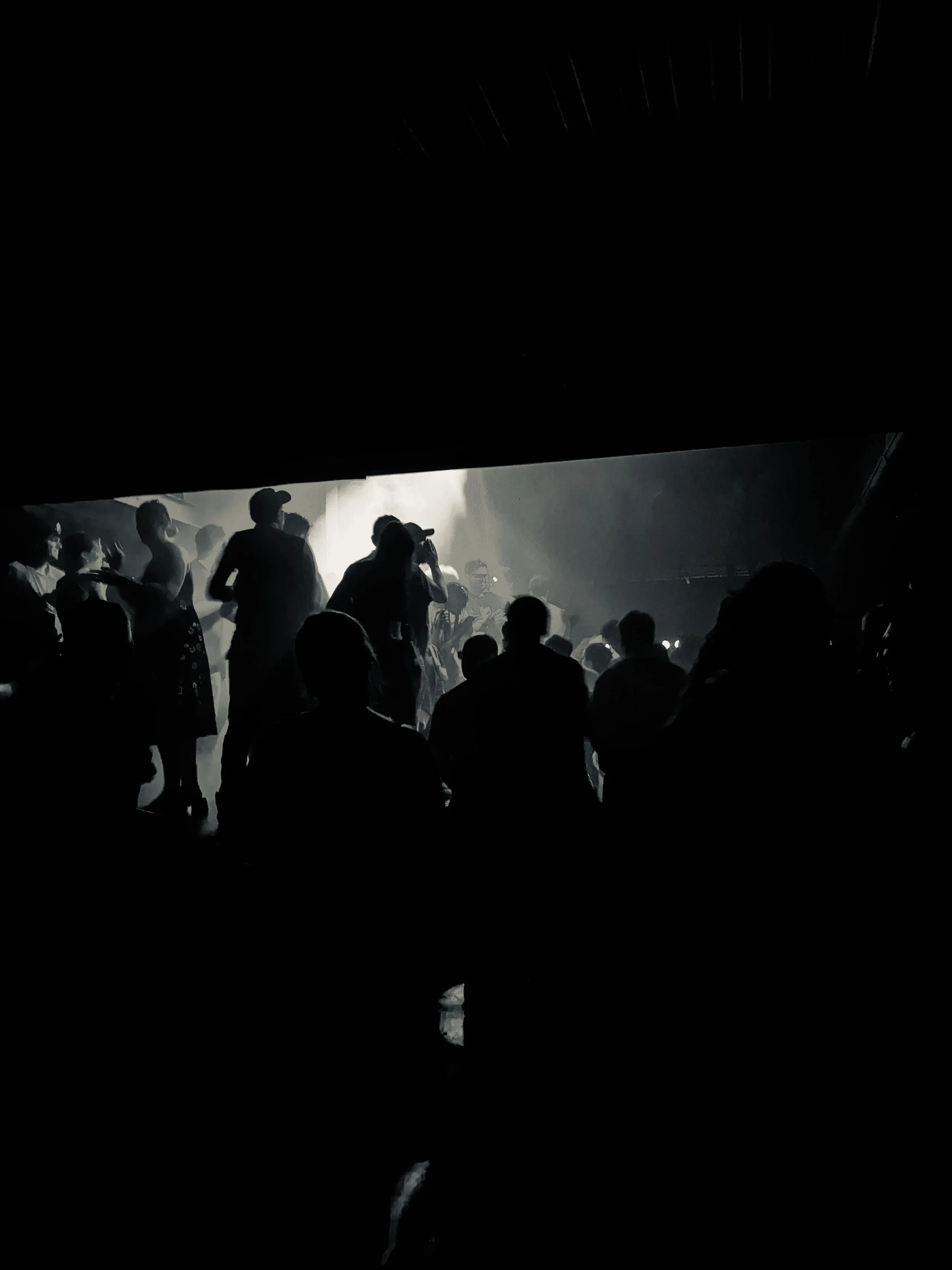 dark silhouette of rave crowd at jazz cafe