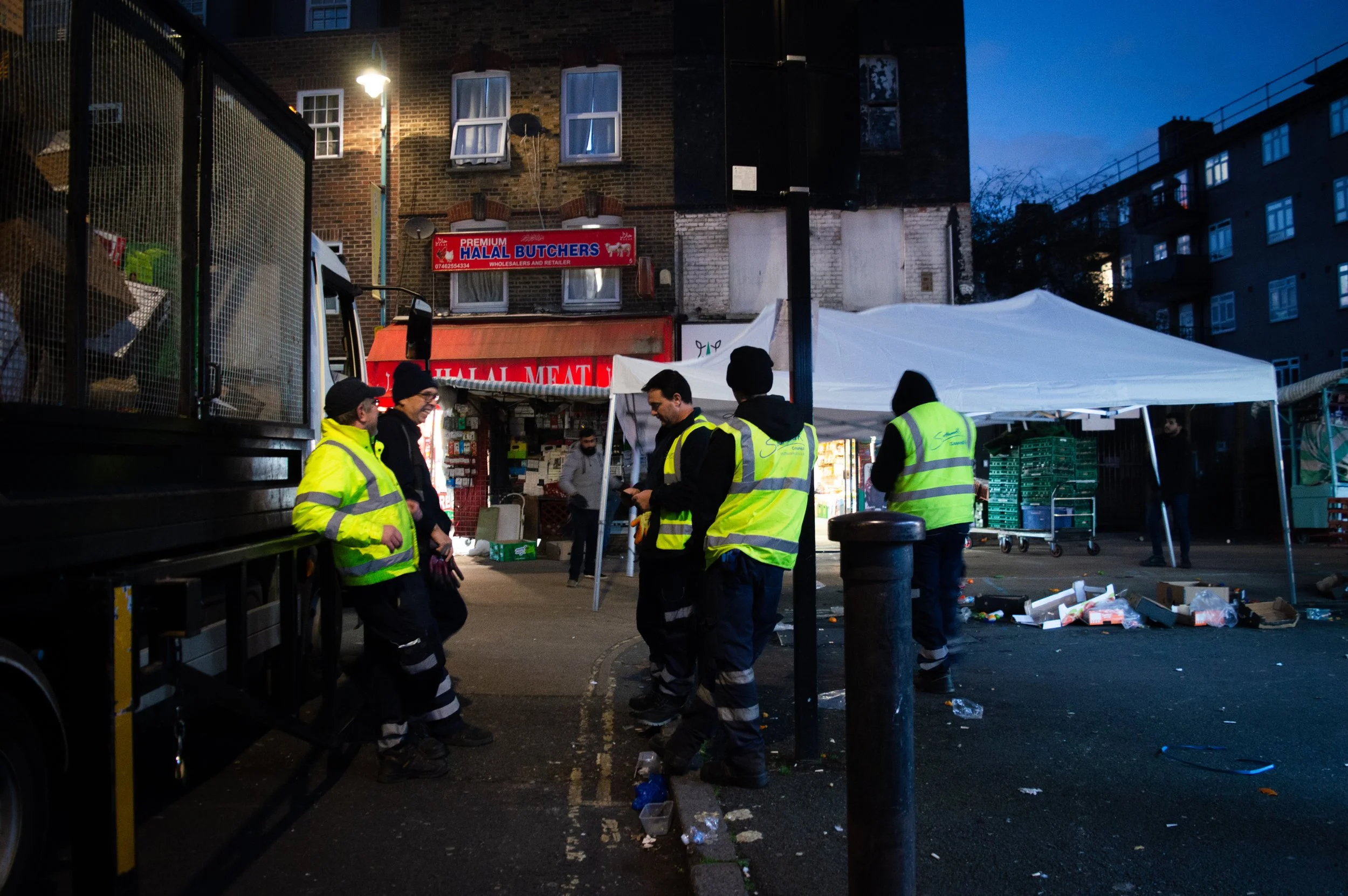 Southwark Council clearing rubbish whilst East Street Market is closing for the day.