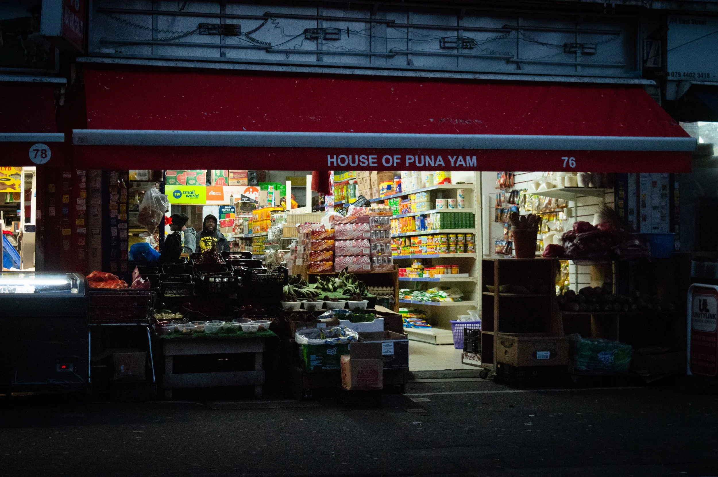 evening landscape of the outside of an indoor market style ethnic food shop