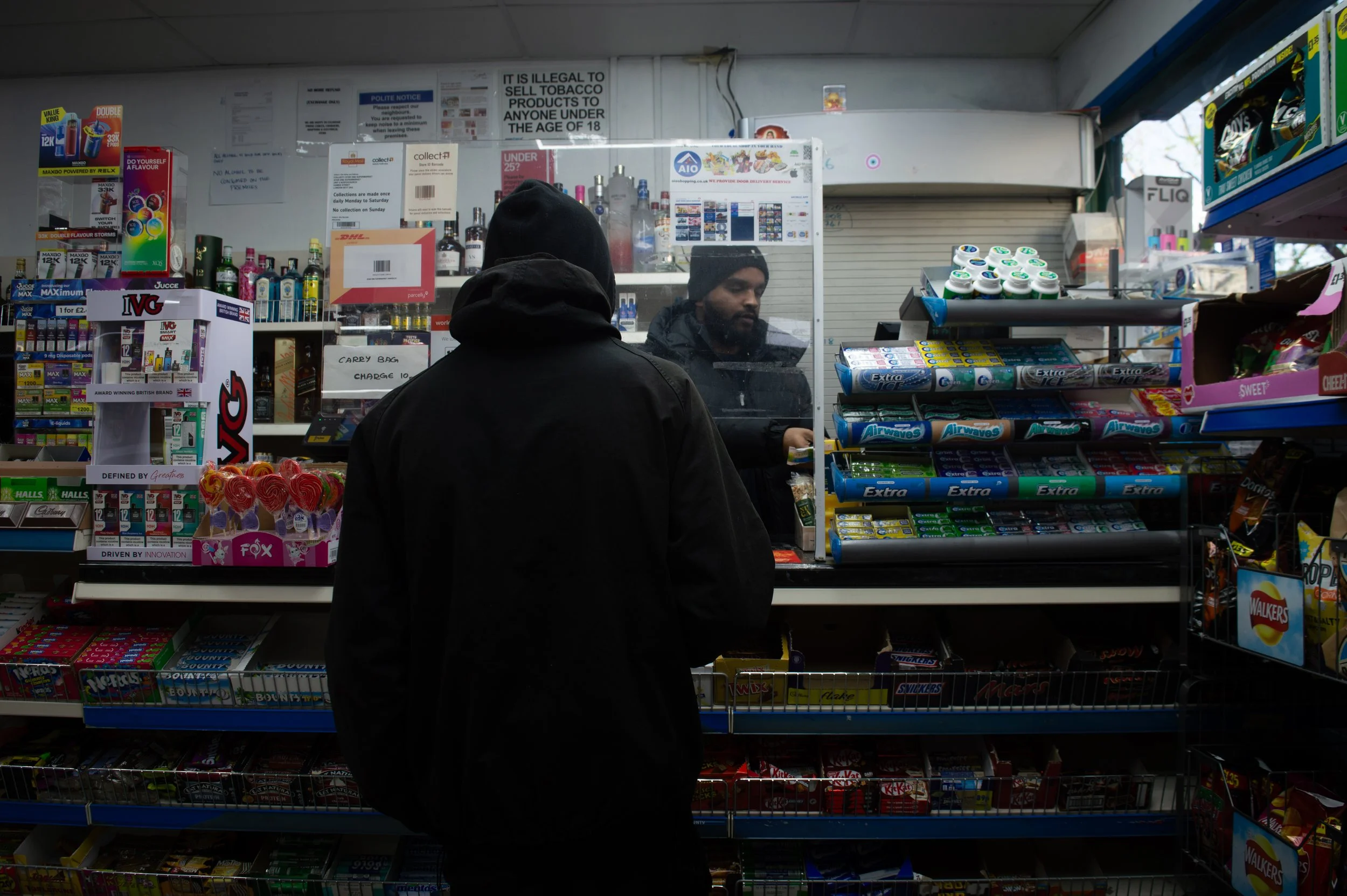 landscape of customer checking out in Aylesbury Estate corner shop