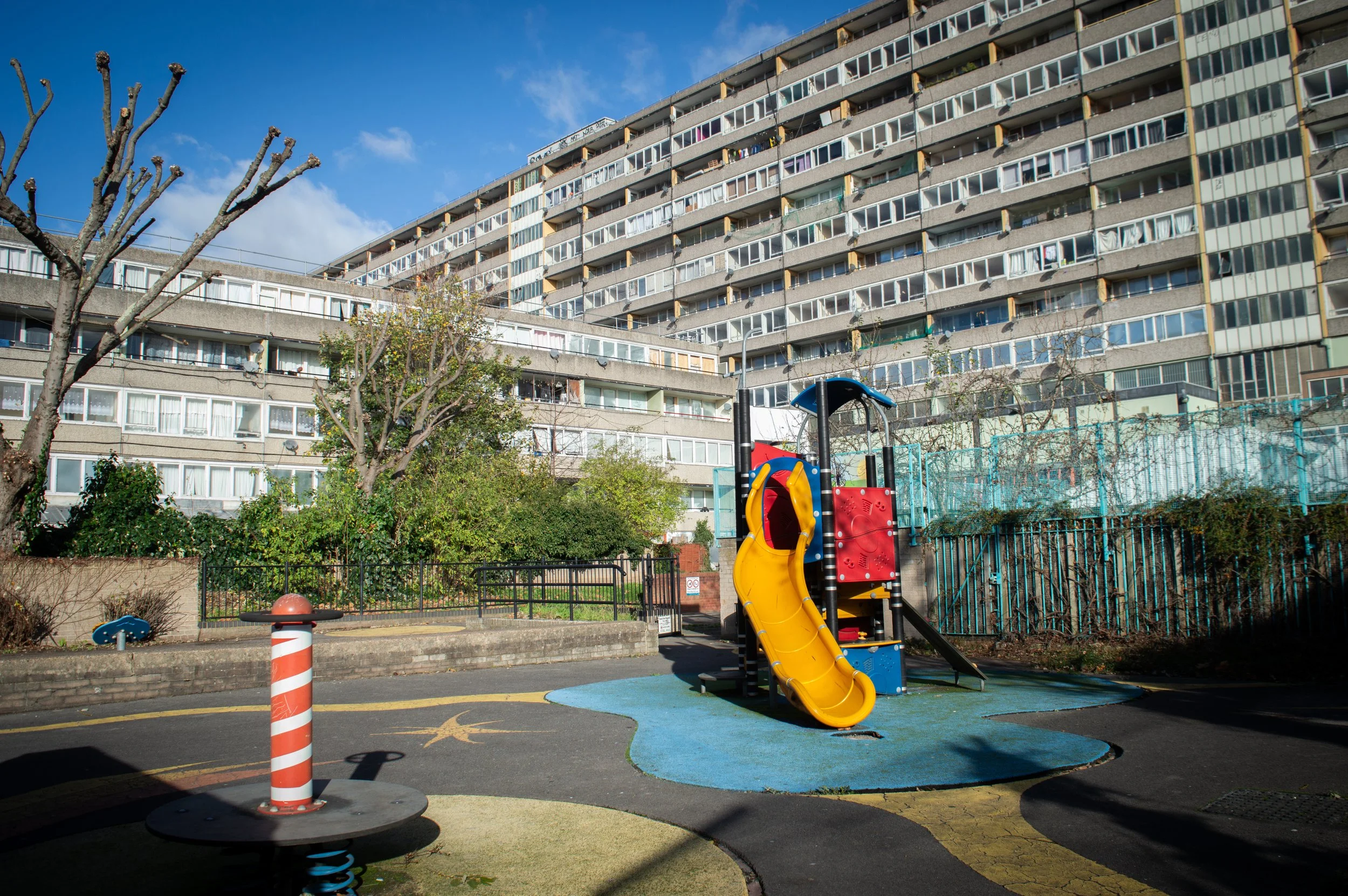 Aylesbury Council Estate colourful children's park with the blocks in the background