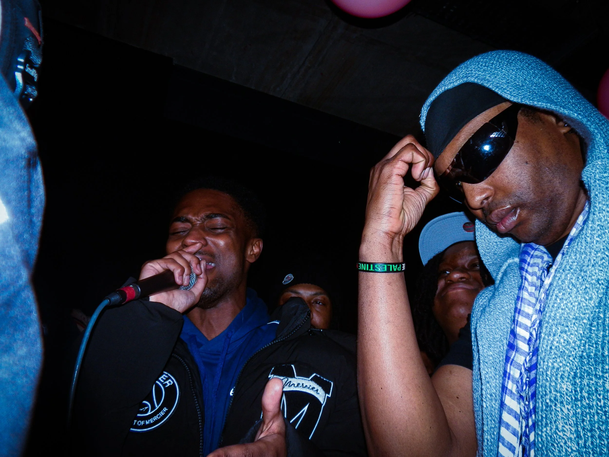 Mez performing at travspresents grime rave in the middle of a crowd 