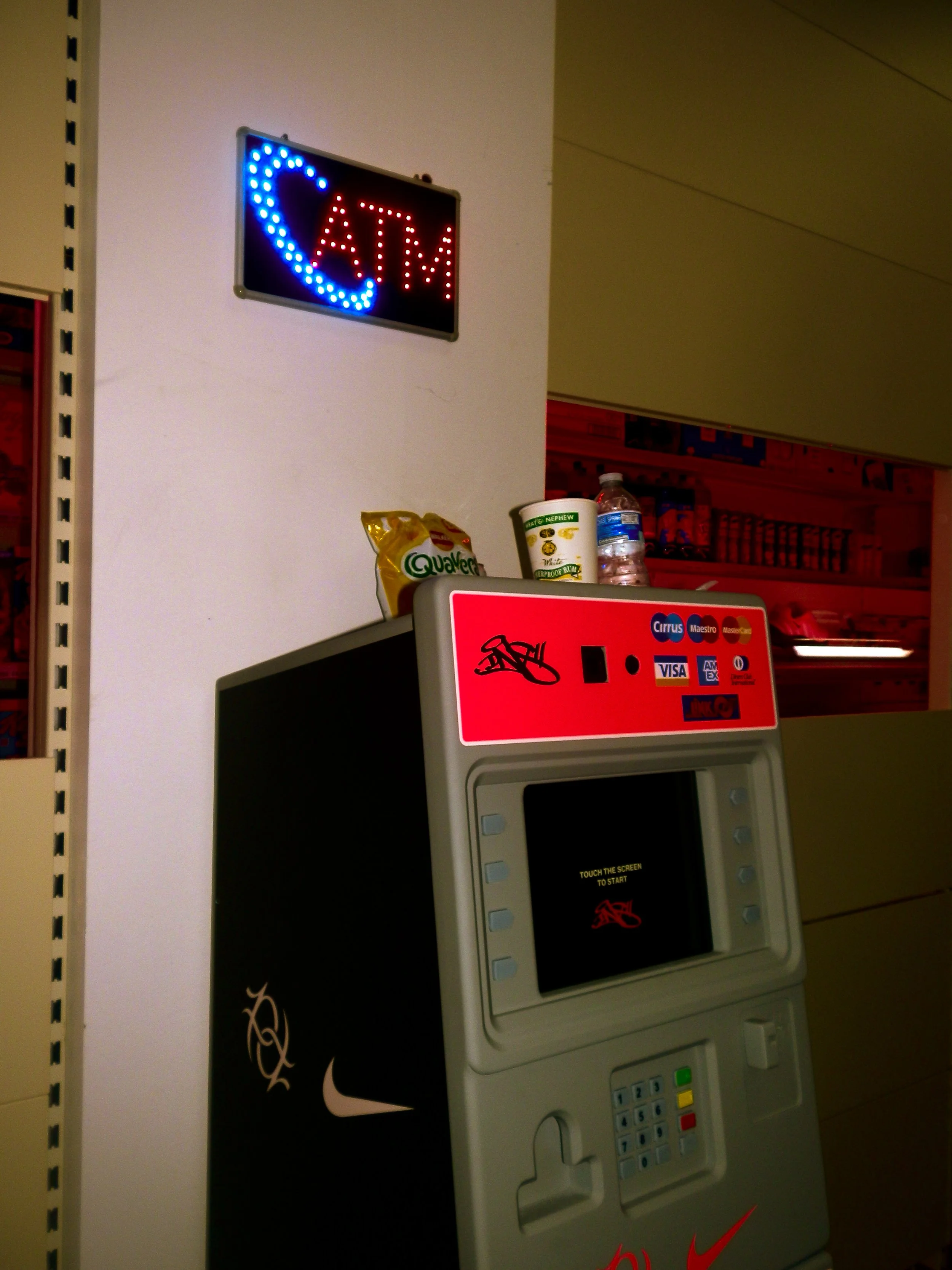 fake ATM with nike and past down vintage branding for collaboration pop up event