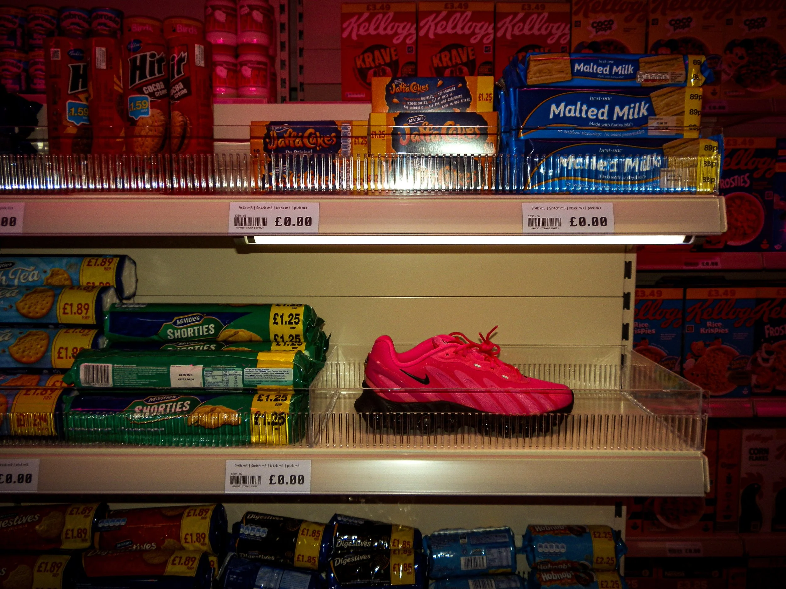 Pink nike trainers on corner shop style shelving at the nike collaboration event with past down vintage