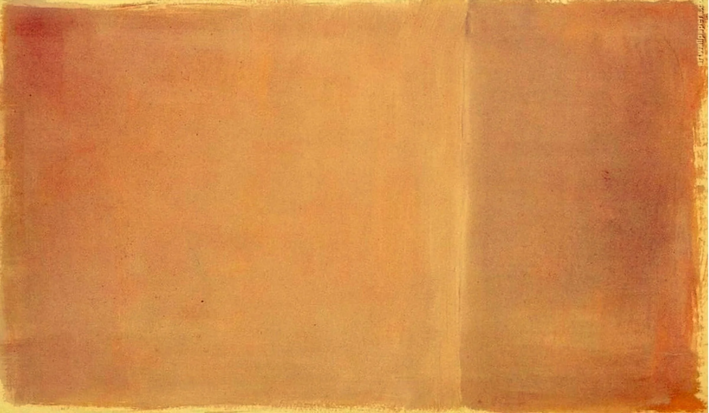 Holiday Phillips with her family, sitting on a porch in front of a wooden door, smiling and laughing, with white and stone pillars on either side of the steps.