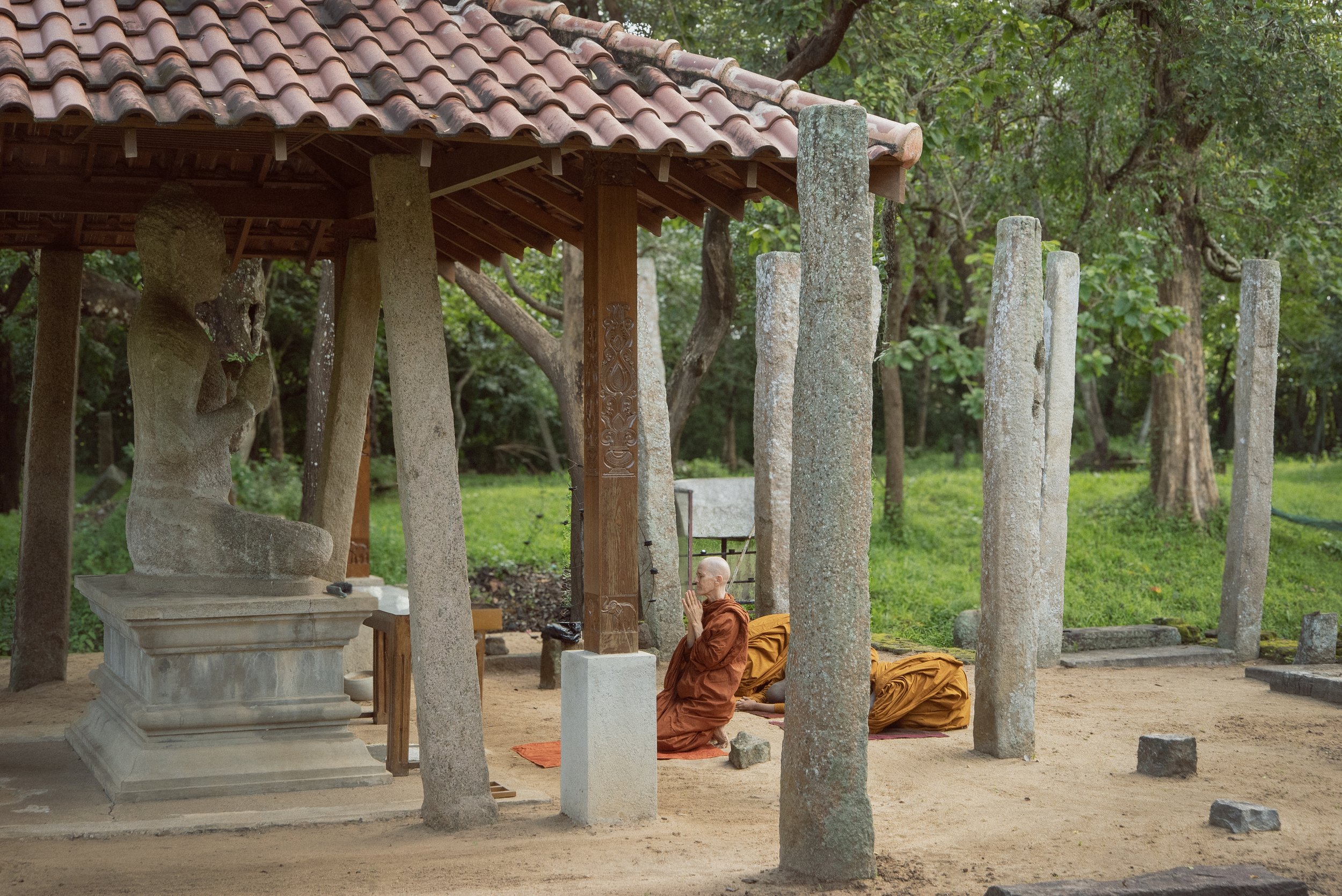 Bikkhuni Saccadharani is praying in front of Buddha statue at Pankuliaya Ashokaramaya