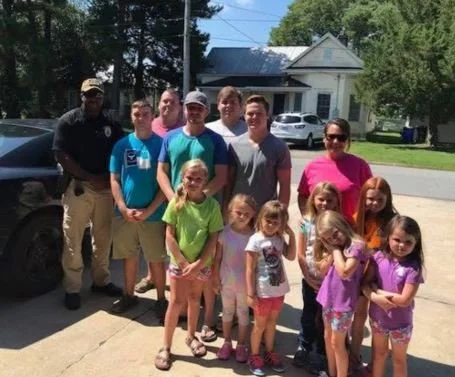 Bobby Knight with families at a community event.