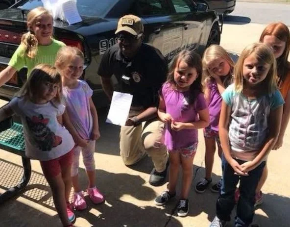 Bobby Knight with kids at community event.