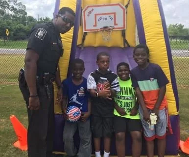 Bobby Knight with kids at community event.