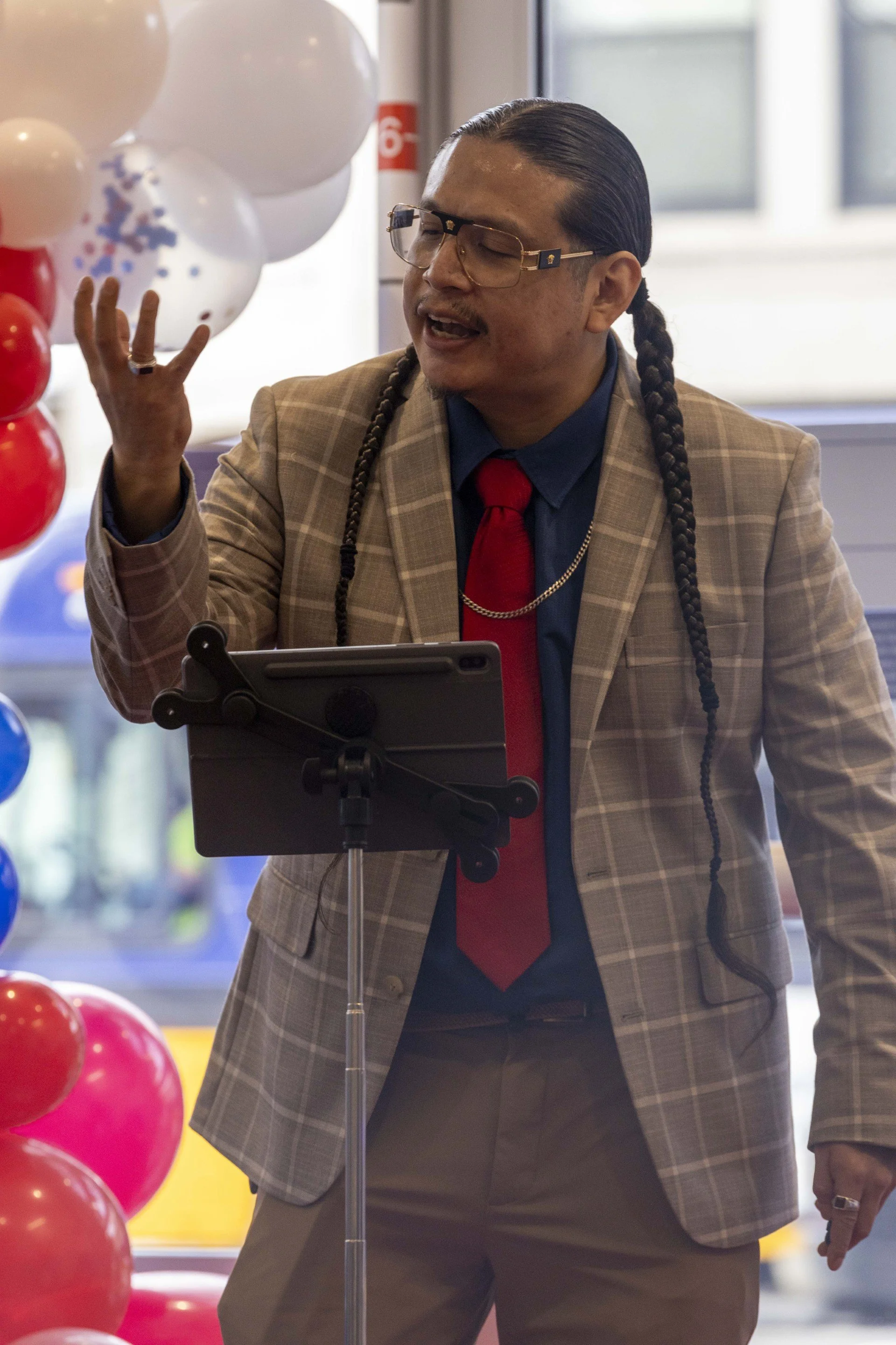 A Red Eagle Soaring community member making a speech.