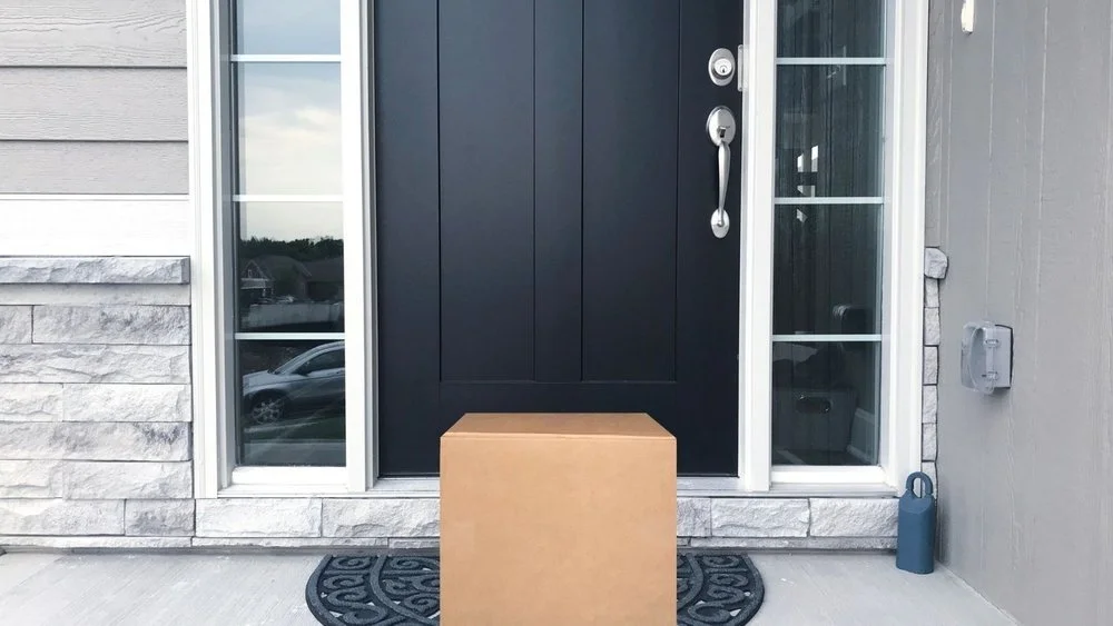 Delivered package at front door of house