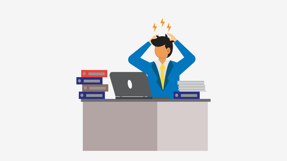Cartoon graphic of man sitting at desk looking stressed