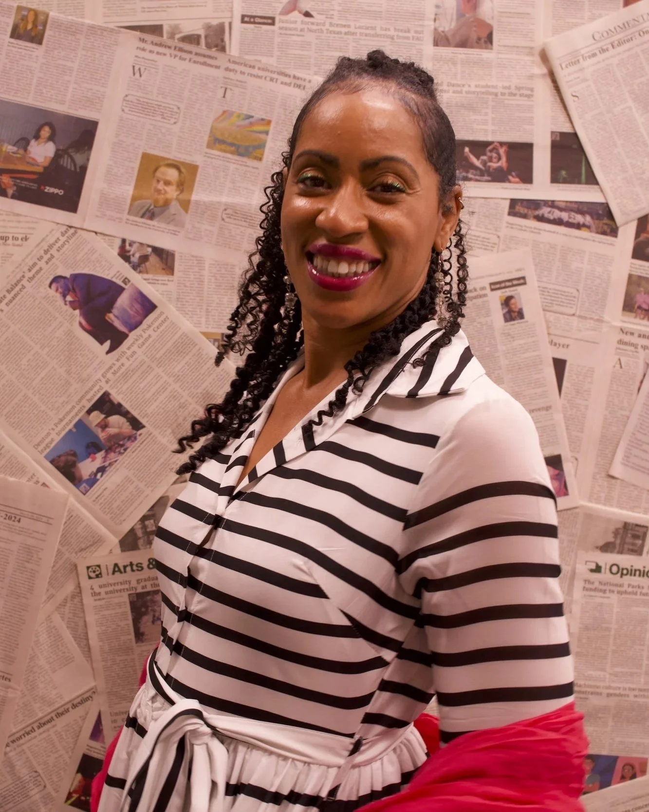 Clinician posing confidently during a professional portrait in a studio setting.