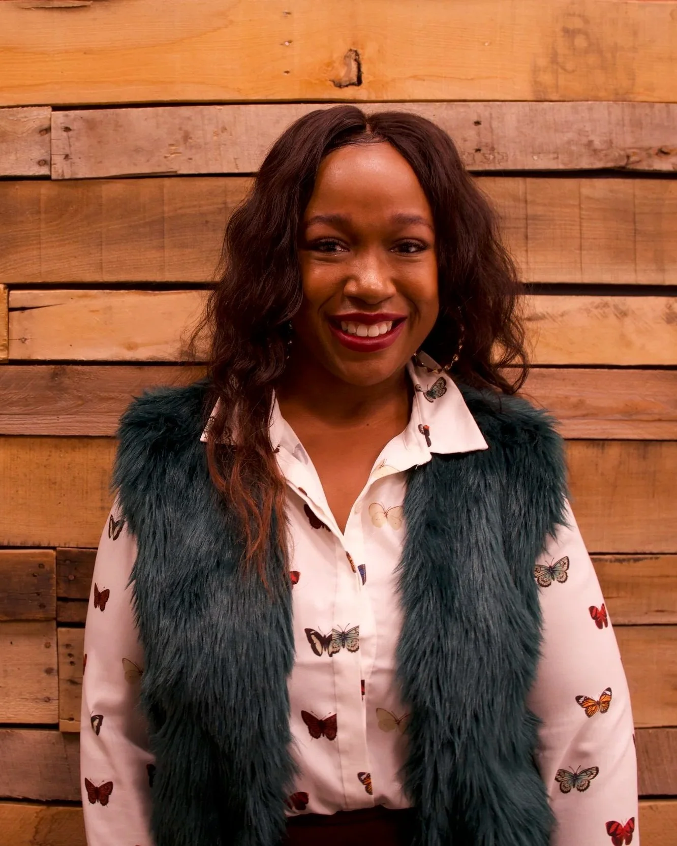 Clinician photographed in a warm, professional portrait setting.