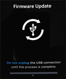 Firmware update screen with a USB icon and instructions to not unplug the USB connection until the process completes.