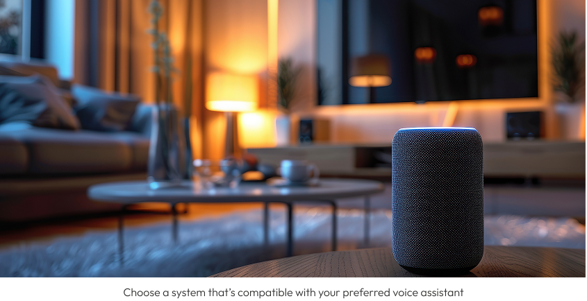 Smart speaker on a wooden table in a cozy living room with a TV, lamp, and couch in the background.
