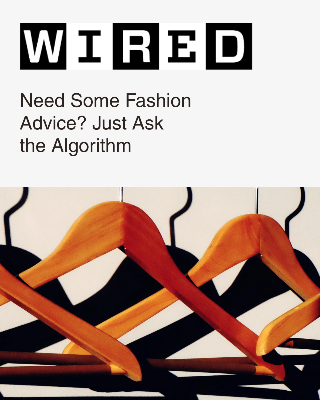 WIRED article titled "Need some fashion advice? Just ask the algorithm". Image of wooden coat hangers hanging on a metal rod.