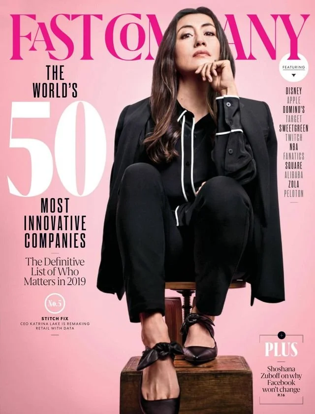 The cover of Fast Company magazine featuring the Most Innovative Companies list. Stitch Fix founder and CEO Katrina Lake sitting on a wooden box, dressed in a black outfit with white trim, high heels with bows
