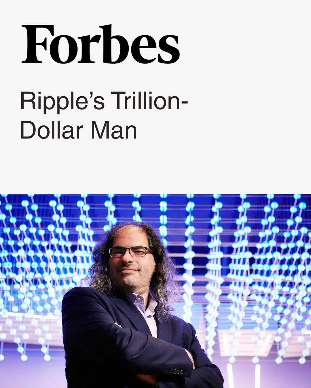 Digital cover of Forbes featuring an article titled Ripple’s Trillion-Dollar Man with a photo of David Schwartz, a man with long hair, glasses, and a suit, standing in front of a blue-lit modern light installation.