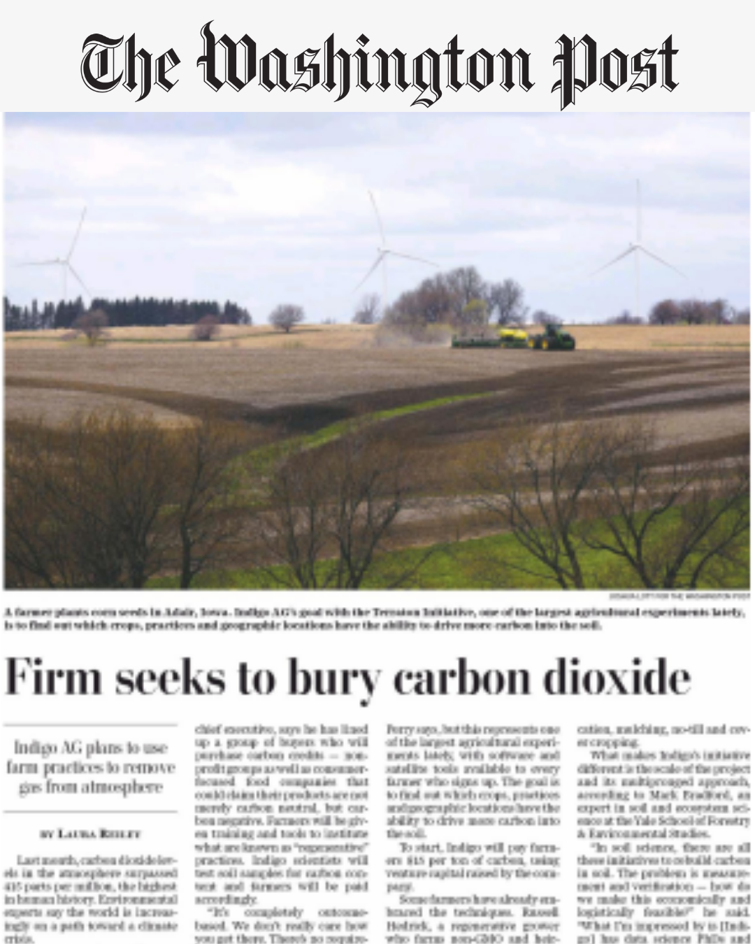 Print article in The Washington Post about Indigo Ag, with a landscape photo of farmland, trees, and wind turbines. Headline reads "Firm seeks to bury carbon dioxide"