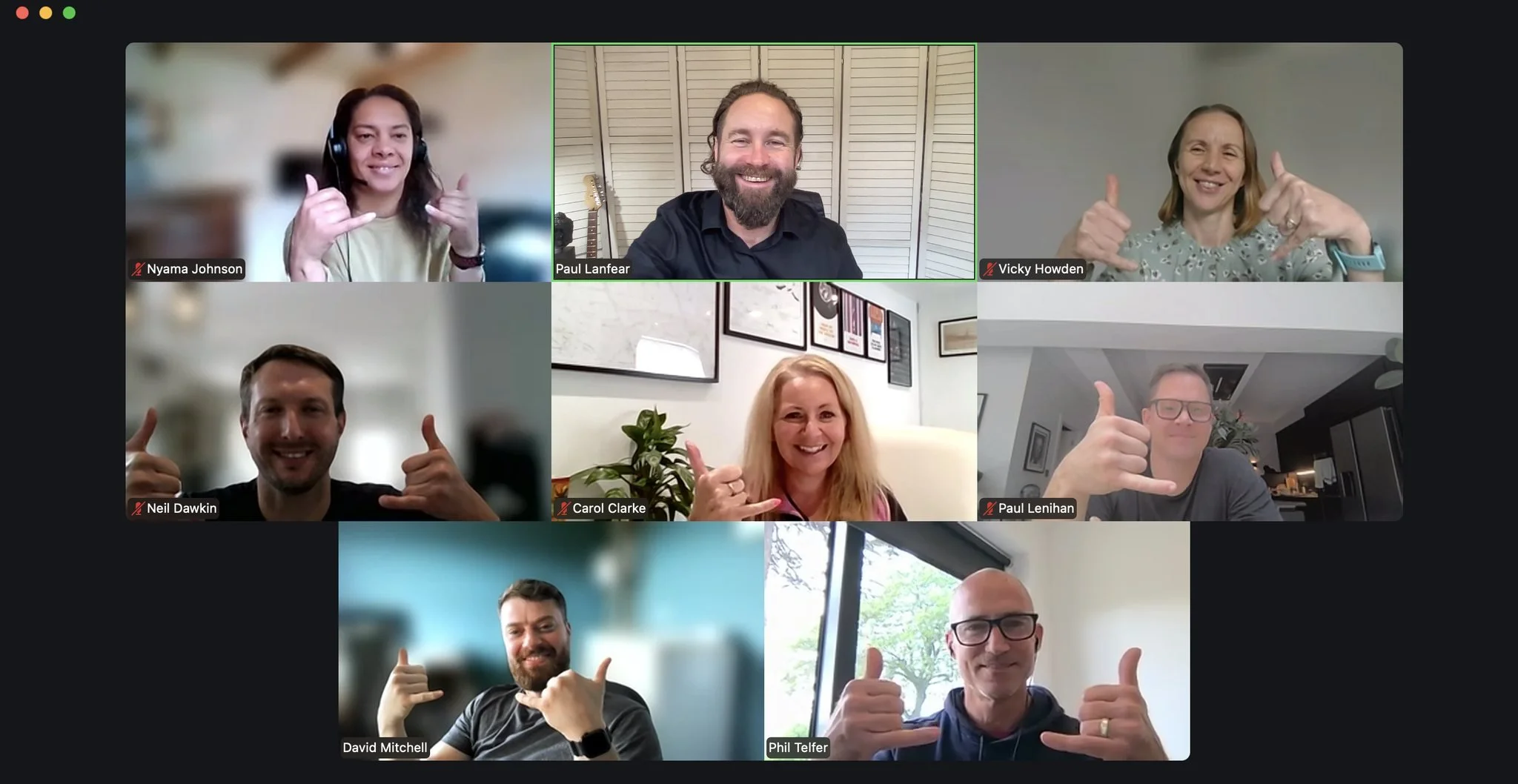 Screenshot of a virtual video conference with nine participants, each giving a thumbs-up, smiling, or making a shaka sign, in different indoor settings.