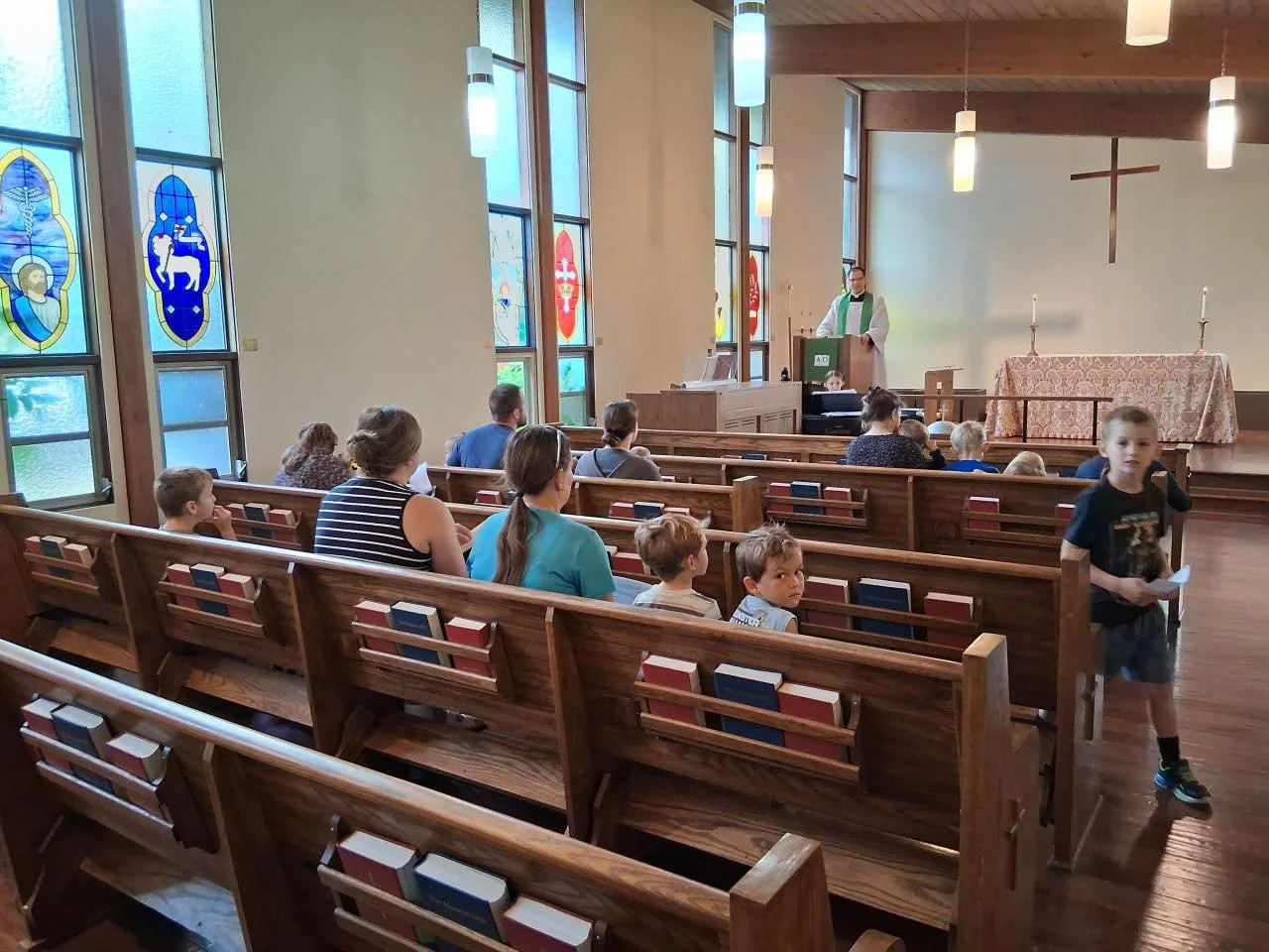 Children and Parents participating in St. John's Homeschool Co-Op gather for Matins, a morning prayer service.