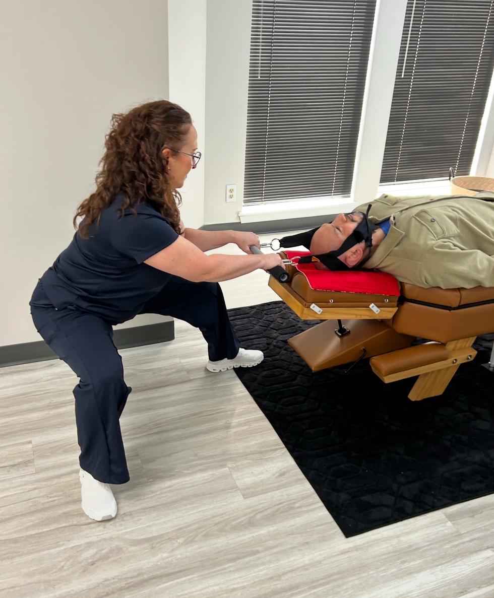 Chiropractor adjusting neck