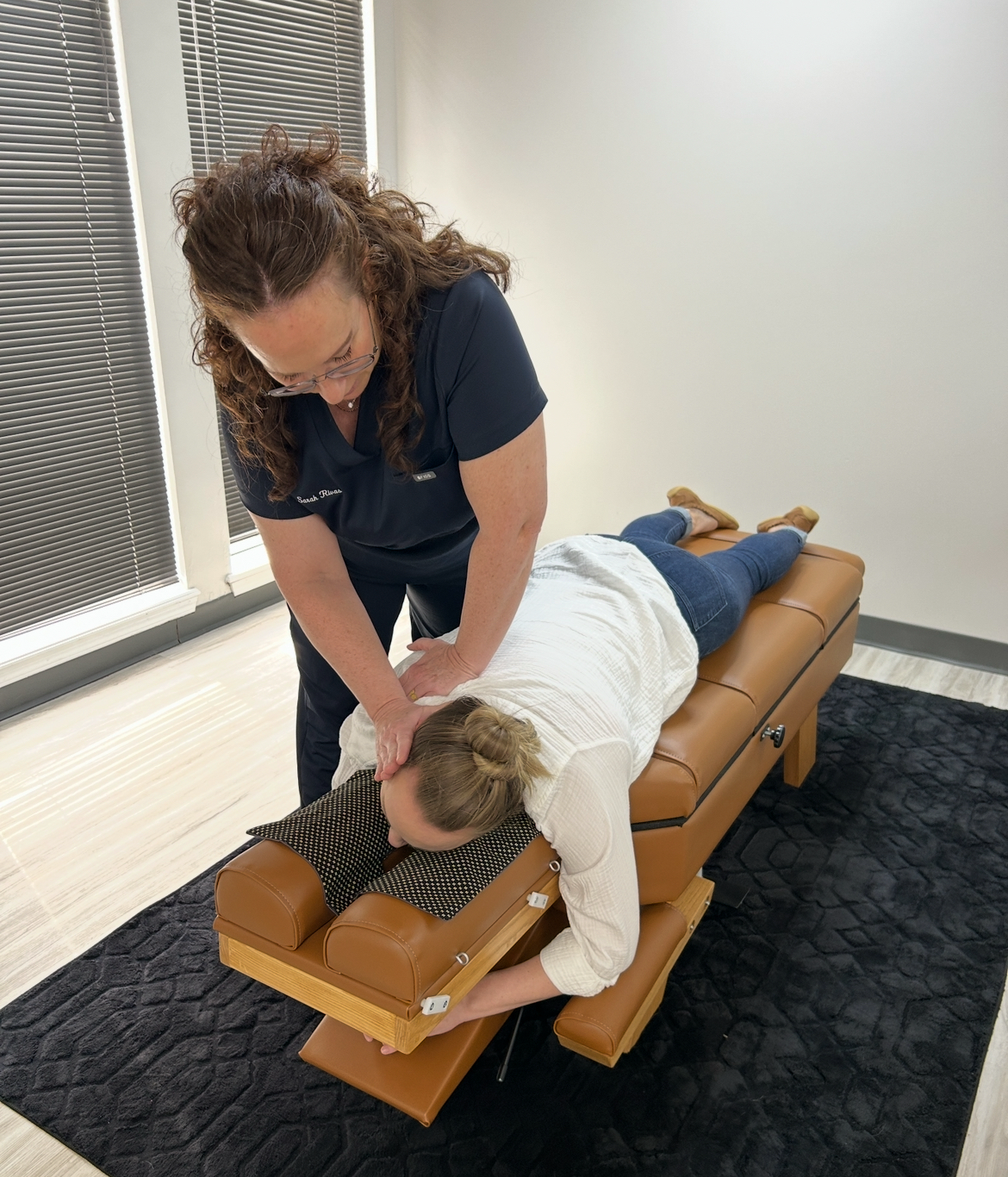 Chiropractor adjusting neck