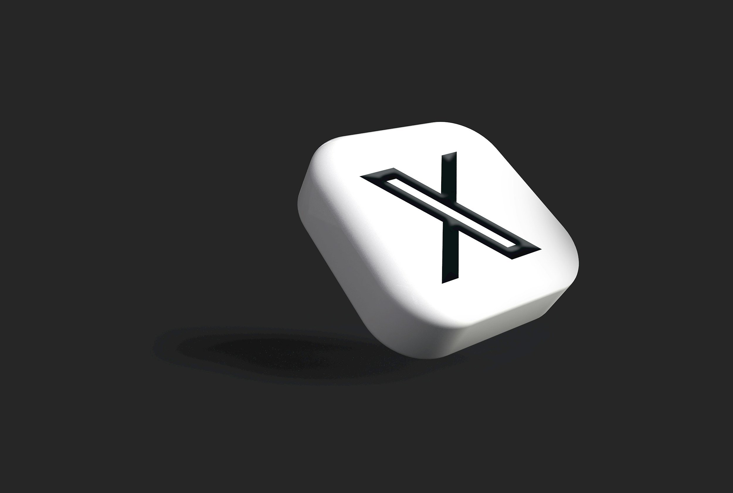 Digital illustration of the X logo with a black background and an X on a white square.