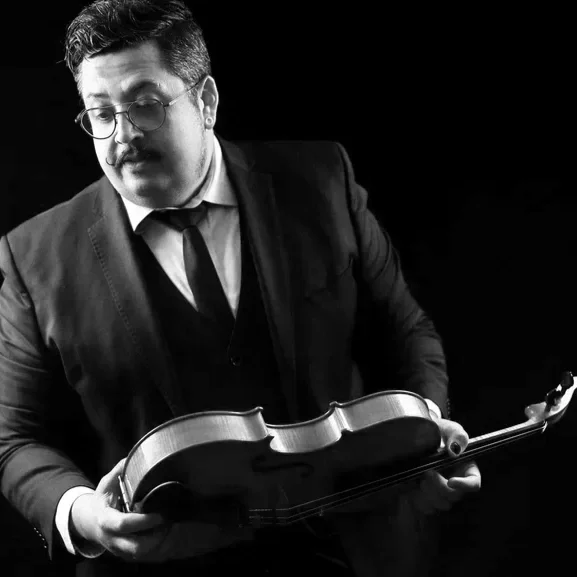 Sean holds his viola