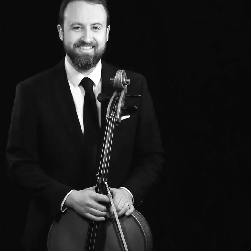 Ryan holds his cello