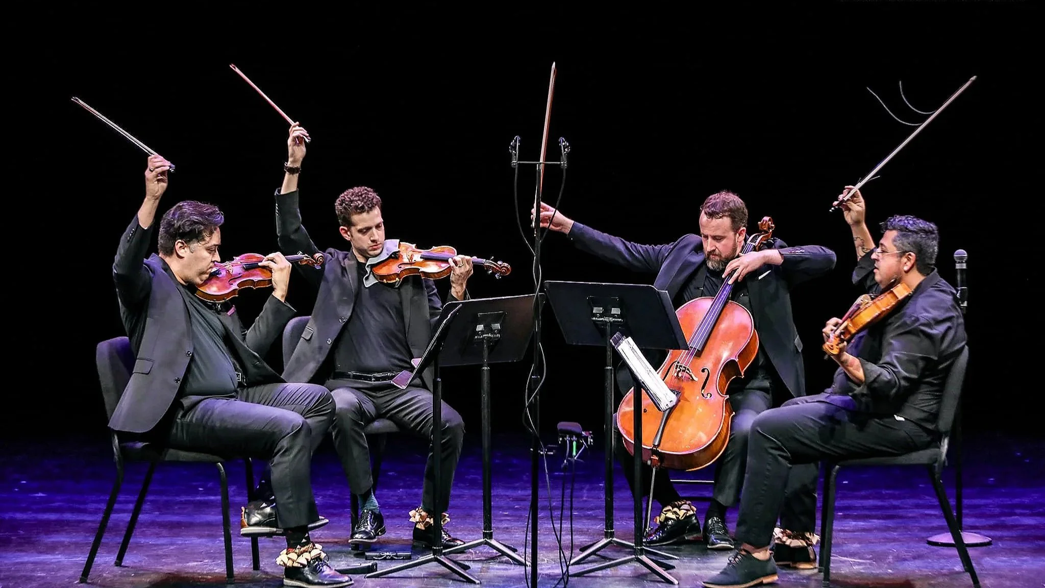 Beo Performs on blue light stage