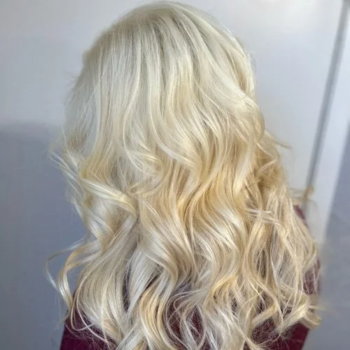 Back view of long, wavy blonde hair.