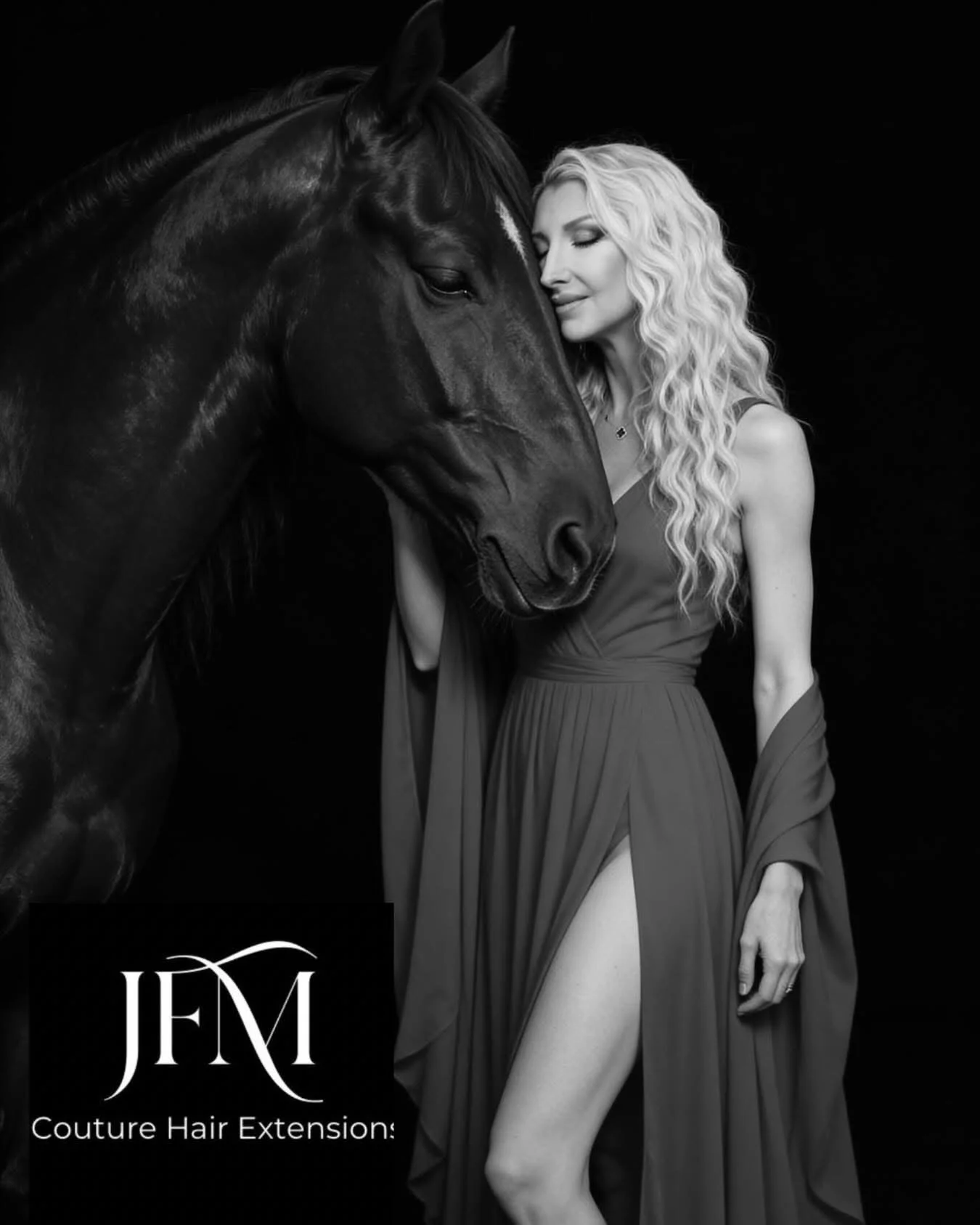 A woman with long, wavy blonde hair and a dress with a high slit stands next to a black horse, both with their eyes closed, against a black background. There is a logo with the text "JFM Couture Hair Extensions" at the bottom left corner.