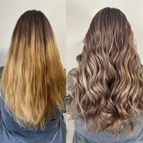 Side-by-side comparison of a woman's long, wavy hair before and after a hair treatment, showing a change from light brown to ash blonde with defined curls.