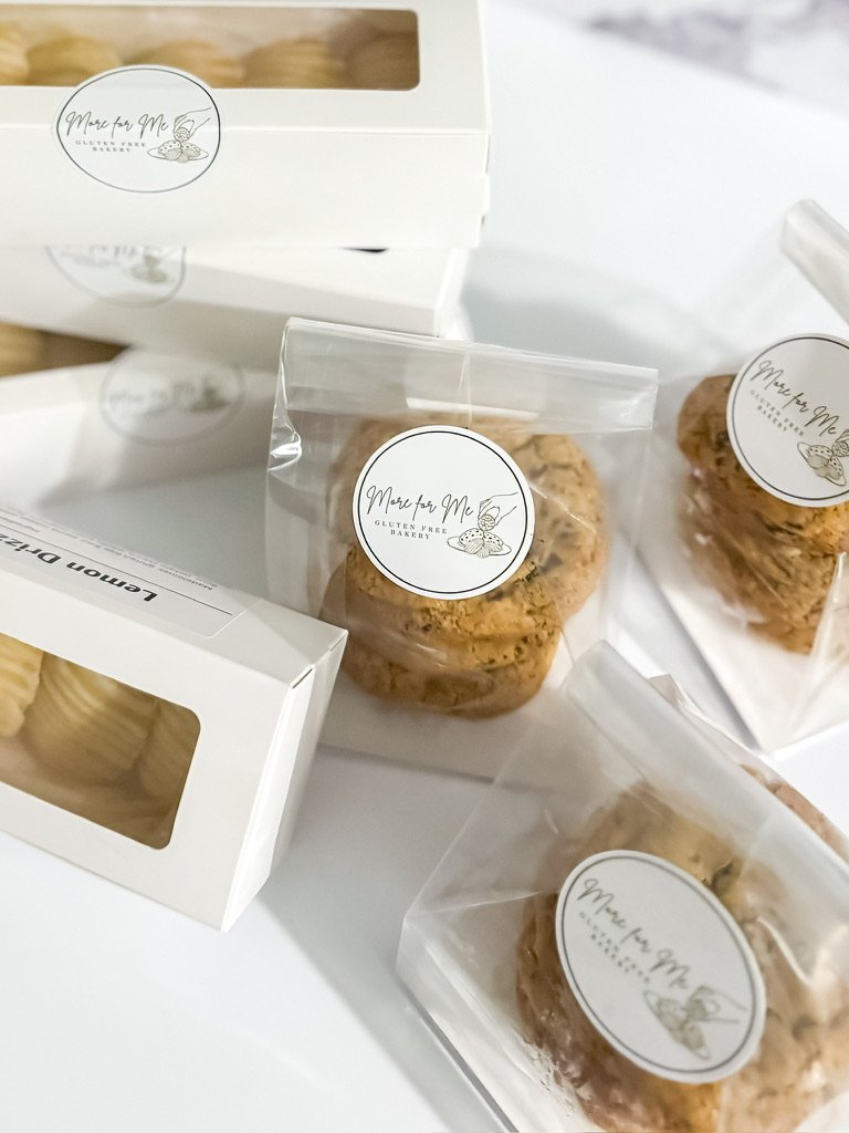 Dessert table spread with gluten-free cookies, cupcakes and cake pops