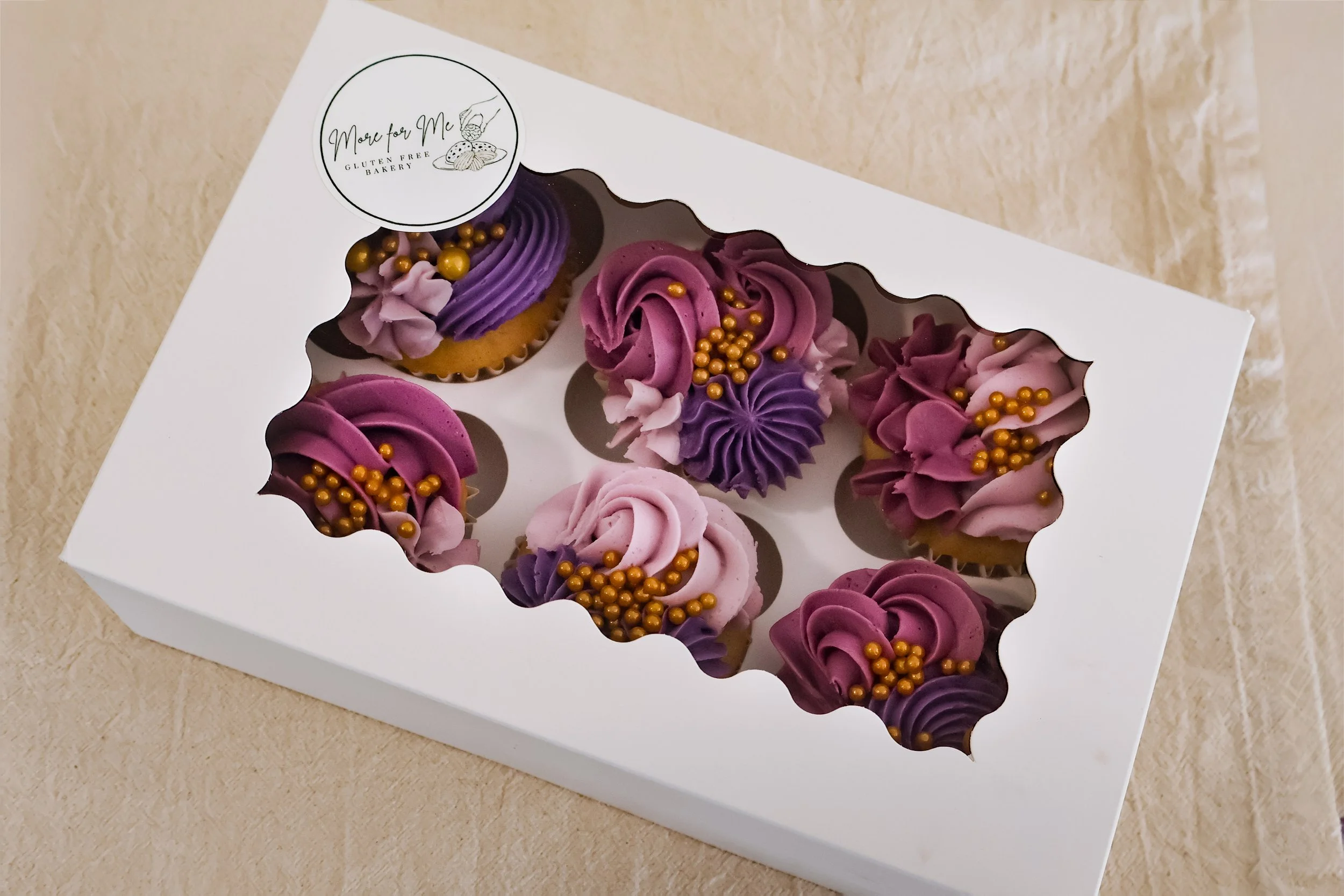 Gluten-free and Dairy-free cupcakes in branded packaging