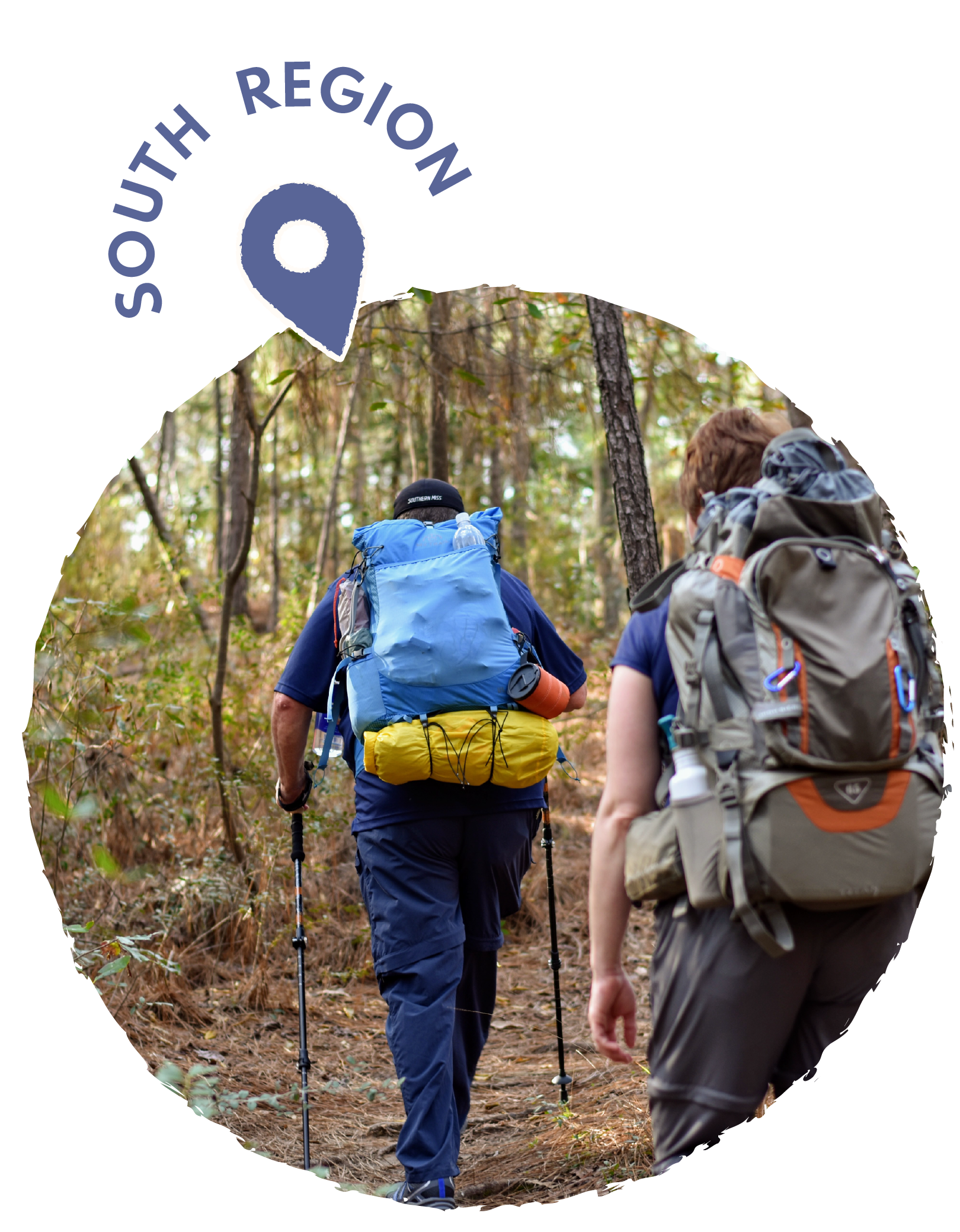 Two hikers walking on a trail through a wooded forest, carrying large backpacks and using trekking poles.
