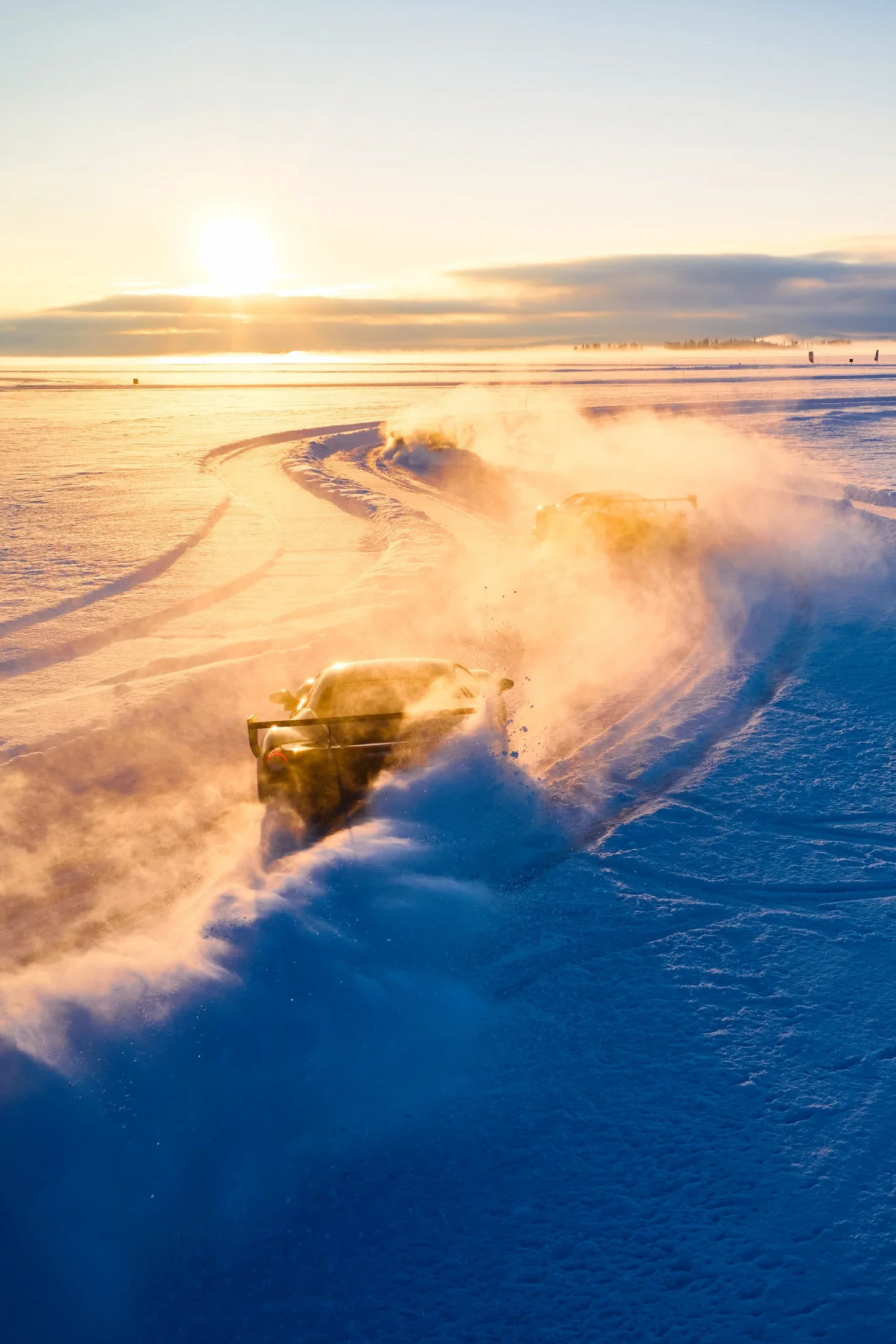 photographe automobile bourg en bresse – Ferrari 488 challenge circuit glace neige Laponie ciel lumière orange Drone