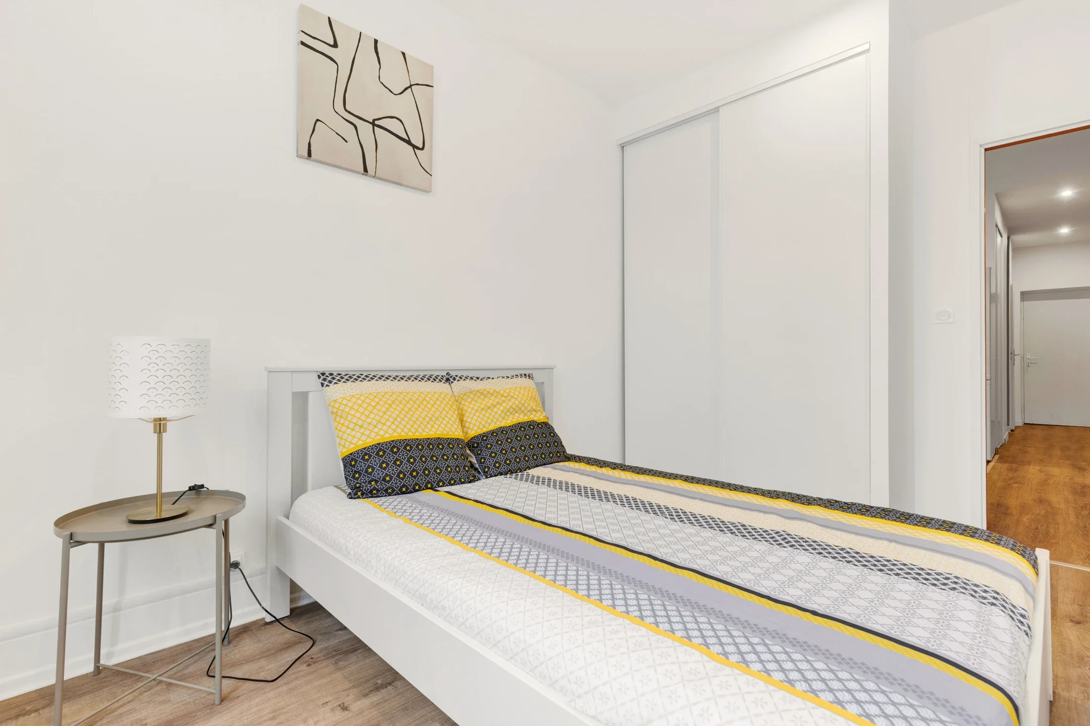 photographe immobilier bourg en bresse – Chambre d'un appartement locatif à bourg en bresse géré par La Conciergerie Bressane