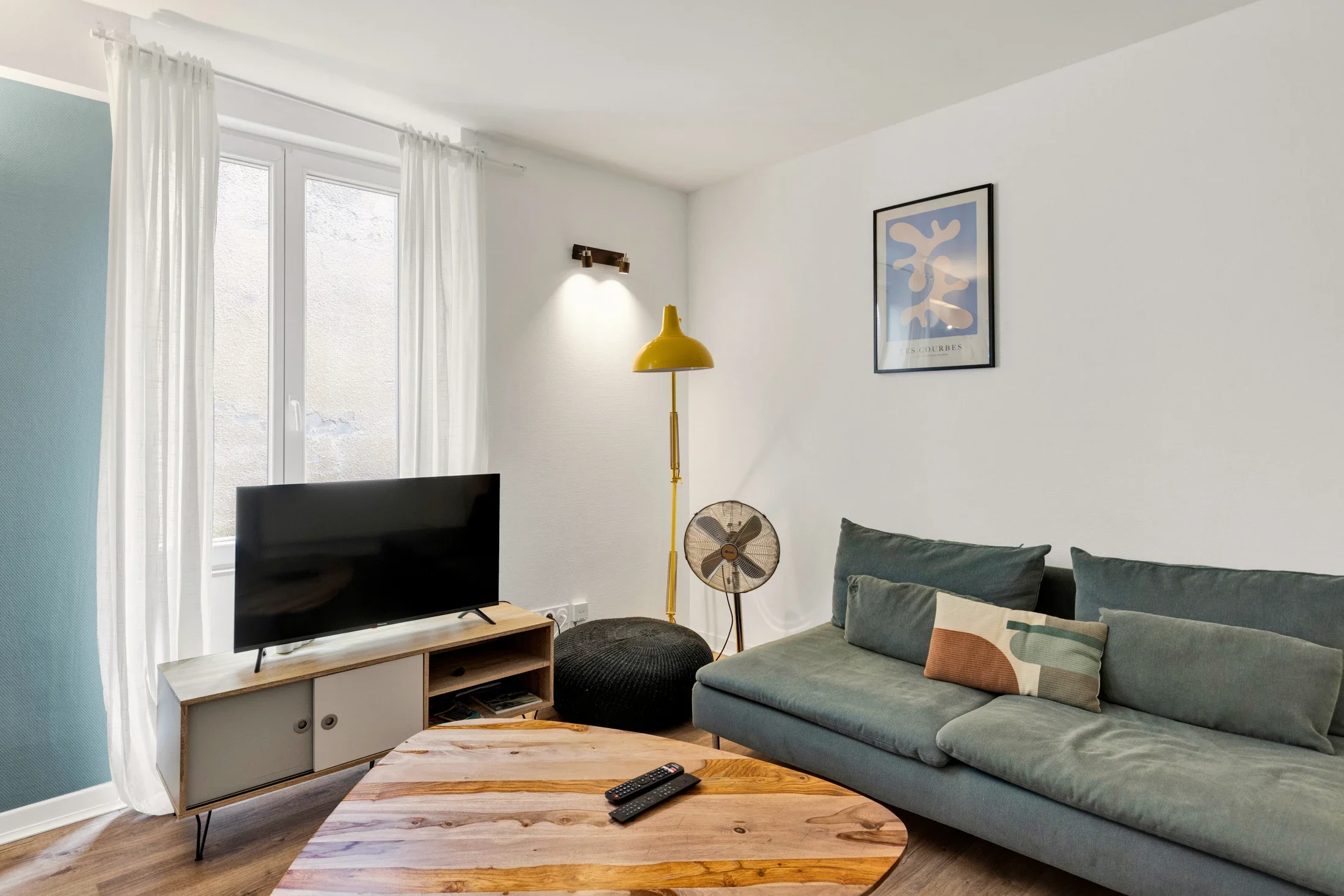 photographe immobilier bourg en bresse – Salon d'un appartement locatif à bourg en bresse géré par La Conciergerie Bressane