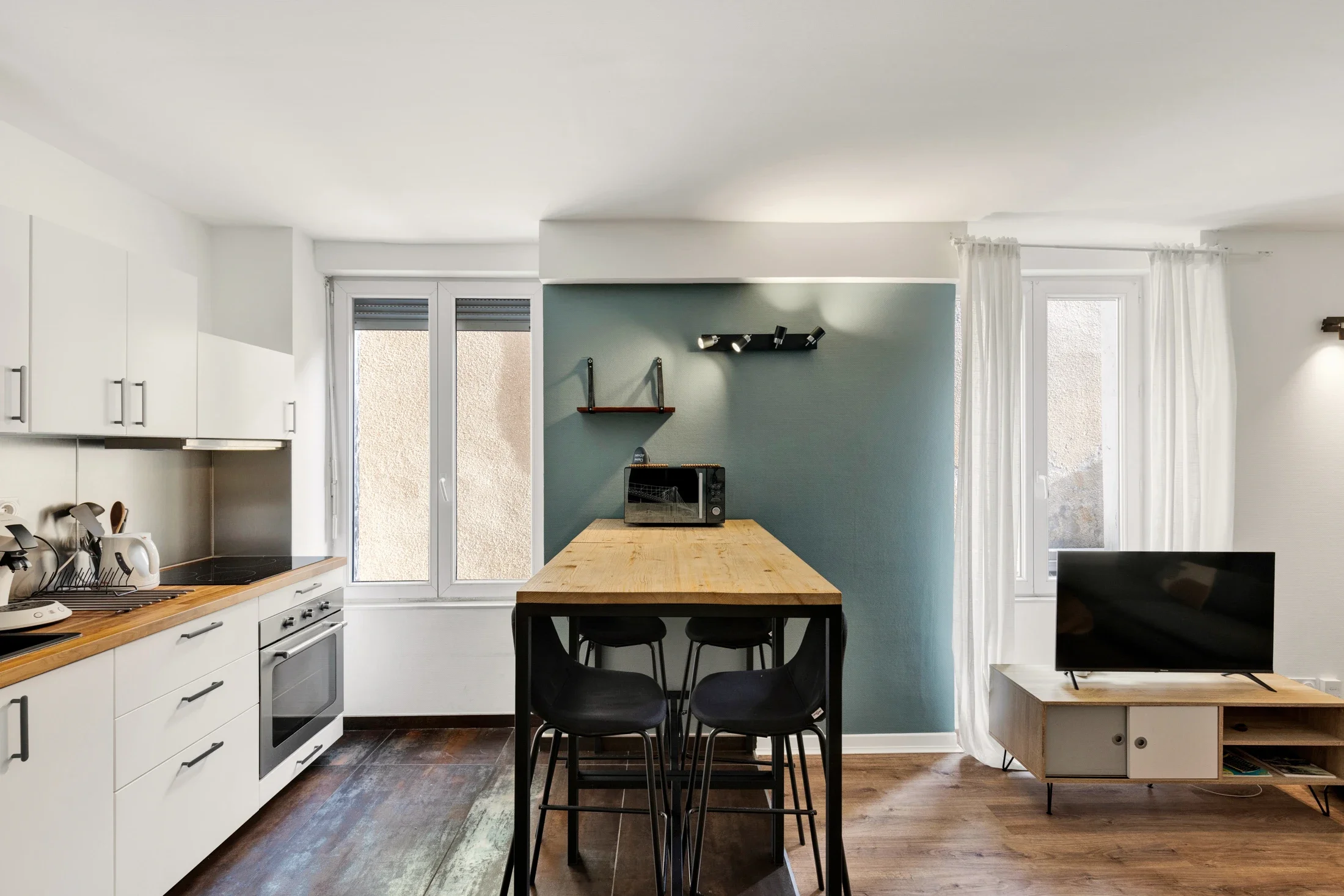 photographe immobilier bourg en bresse – Cuisine d'un appartement locatif à bourg en bresse géré par La Conciergerie Bressane