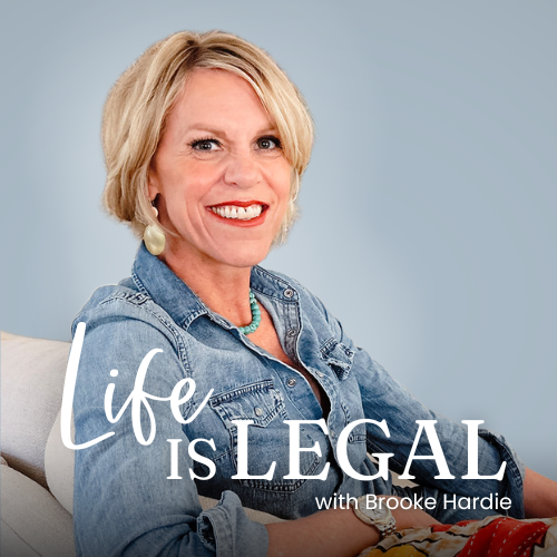 A smiling middle-aged woman with blonde hair, wearing a denim jacket and turquoise jewelry, sitting on a light-colored couch against a light blue background. The text overlay reads 'Life is Legal with Brooke Hardie.'